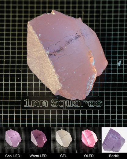 Nd:GGG Corner (Edge Damage) Gem Rough Under Multiple Lights Showing the Color Change