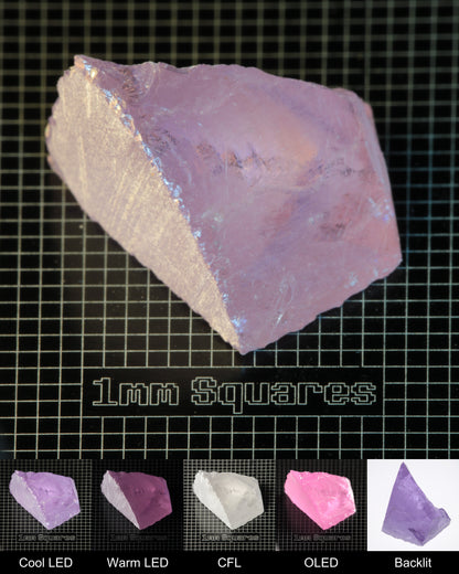 Nd:GGG Wedge Gem Rough Under Multiple Lights Showing the Color Change