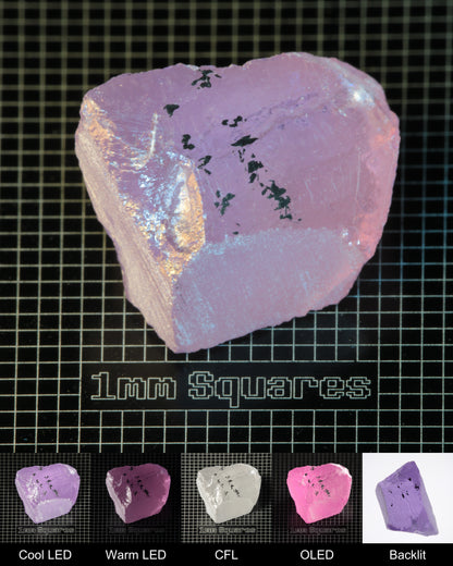 Nd:GGG Block Gem Rough Under Multiple Lights Showing the Color Change