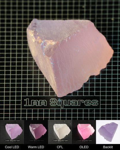 Nd:GGG Wedge Gem Rough Under Multiple Lights Showing the Color Change