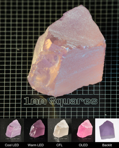 Nd:GGG Block Gem Rough Under Multiple Lights Showing the Color Change