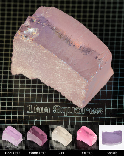Nd:GGG Block Gem Rough Under Multiple Lights Showing the Color Change