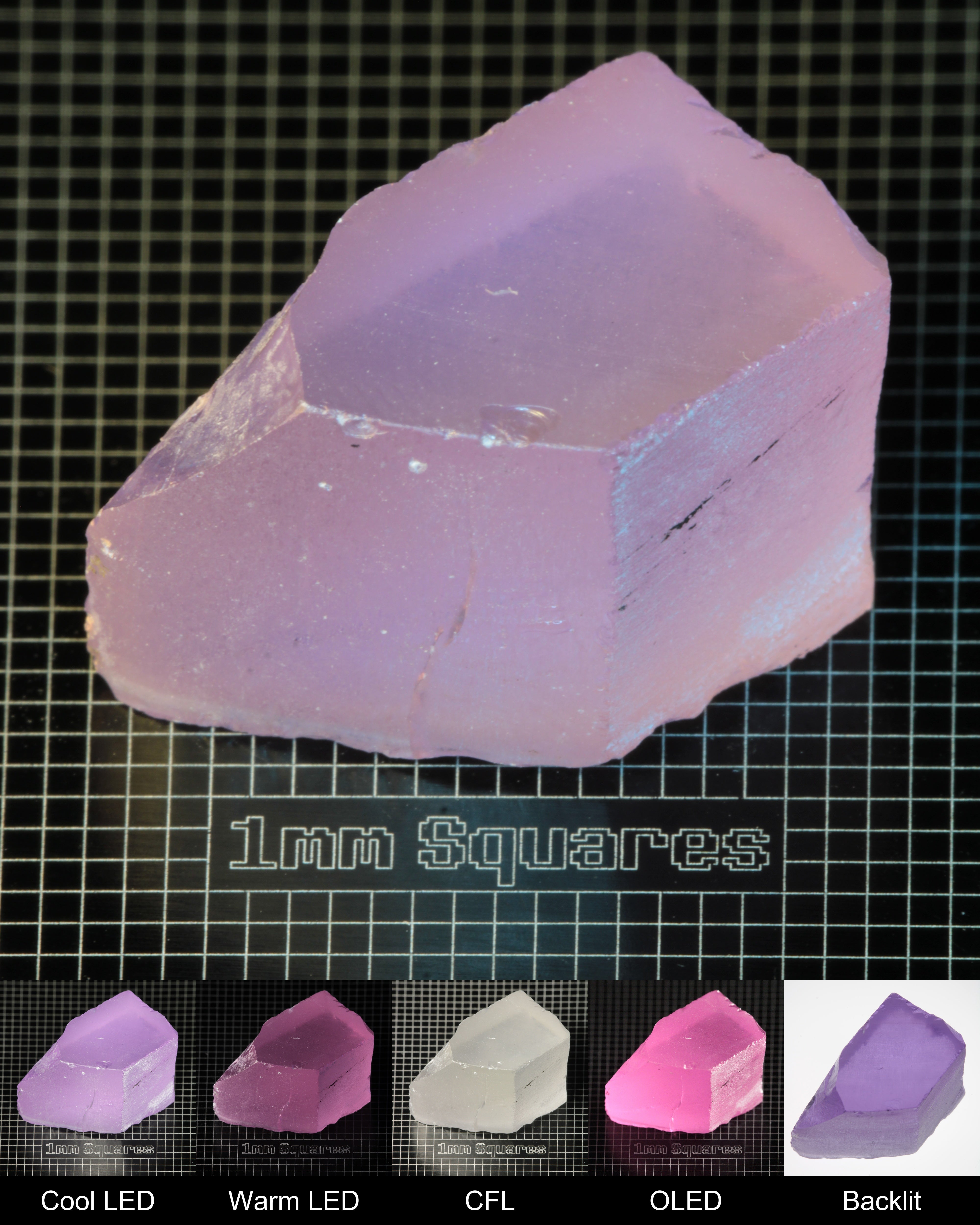 Nd:GGG Block Gem Rough Under Multiple Lights Showing the Color Change