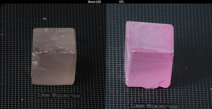 Individual piece of Nd/Er YAG, showing color change with the yellow color under warm LEDs on the left, and the pink color under CFL on the right.