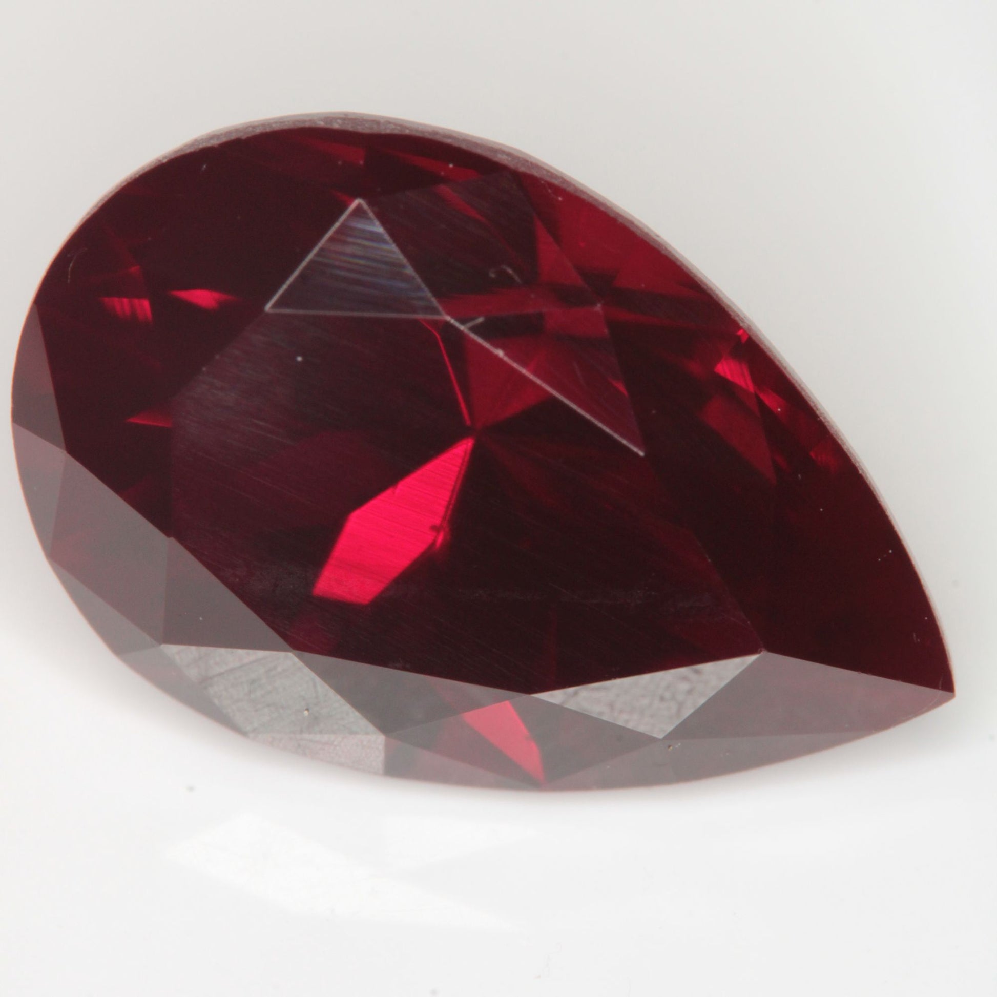 Faceted Flame Fusion Ruby Pear Gemstone