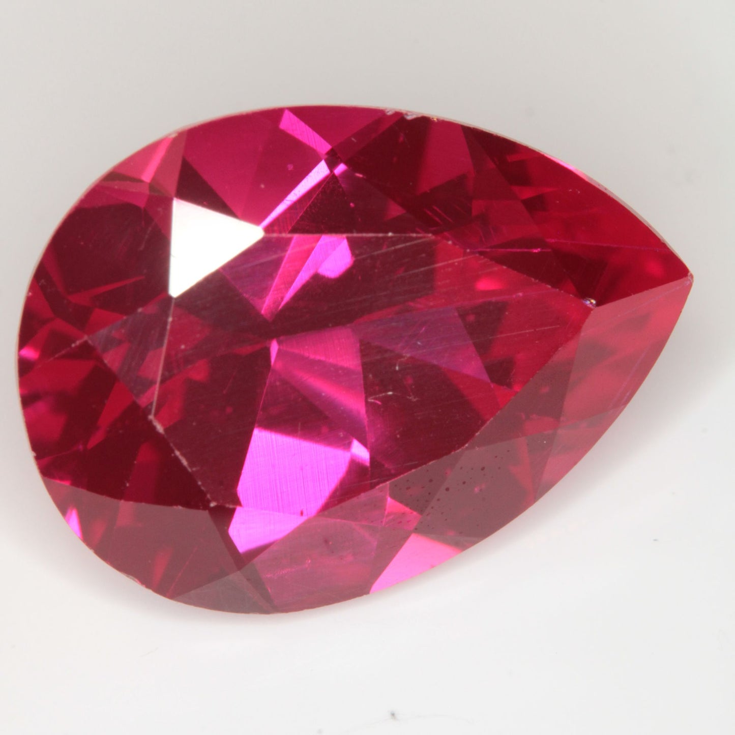 Faceted Flame Fusion Ruby Pear Gemstone
