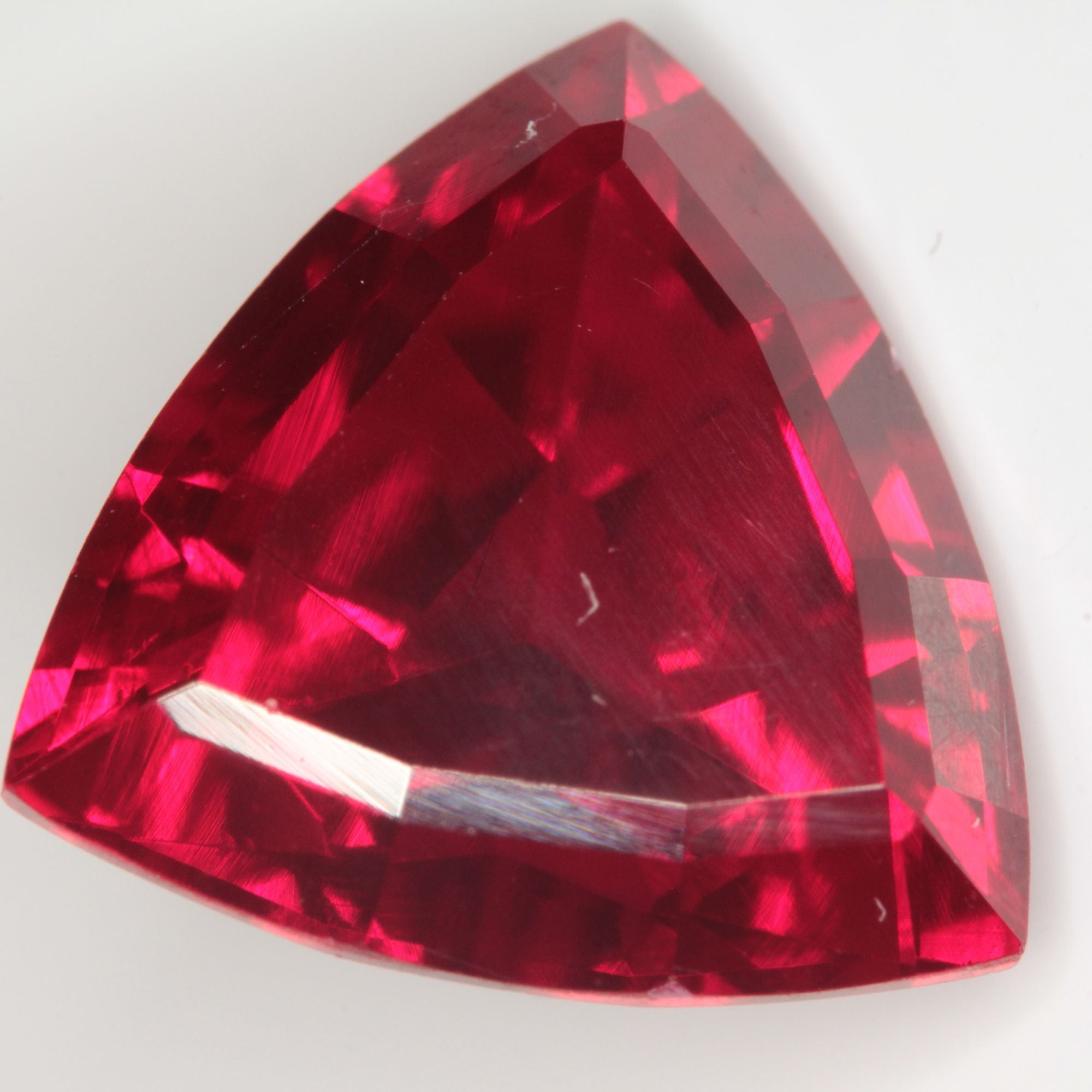 Faceted Flame Fusion Ruby Trillion Gemstone