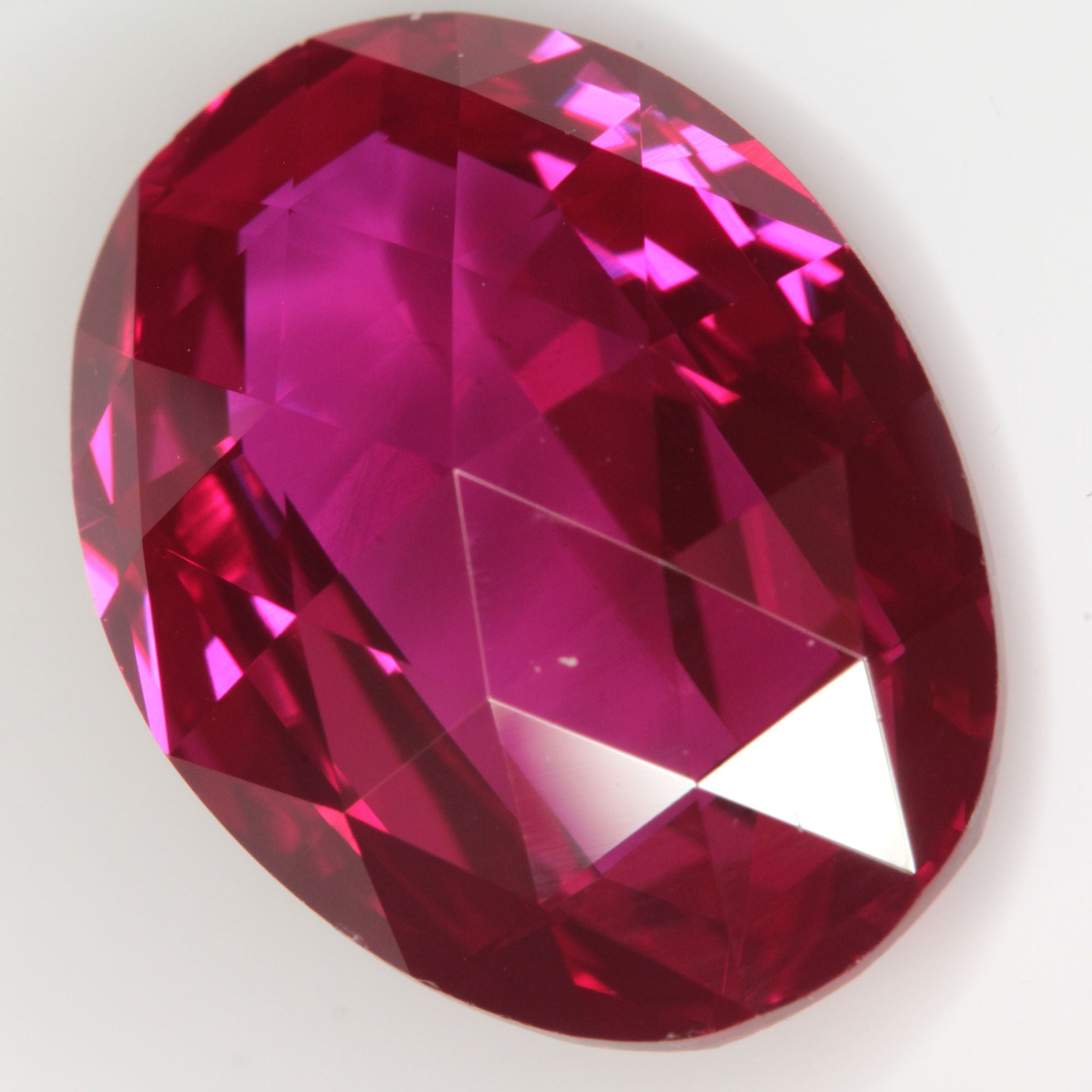 Faceted Flame Fusion Ruby Checkerboard Bent Oval Gemstone
