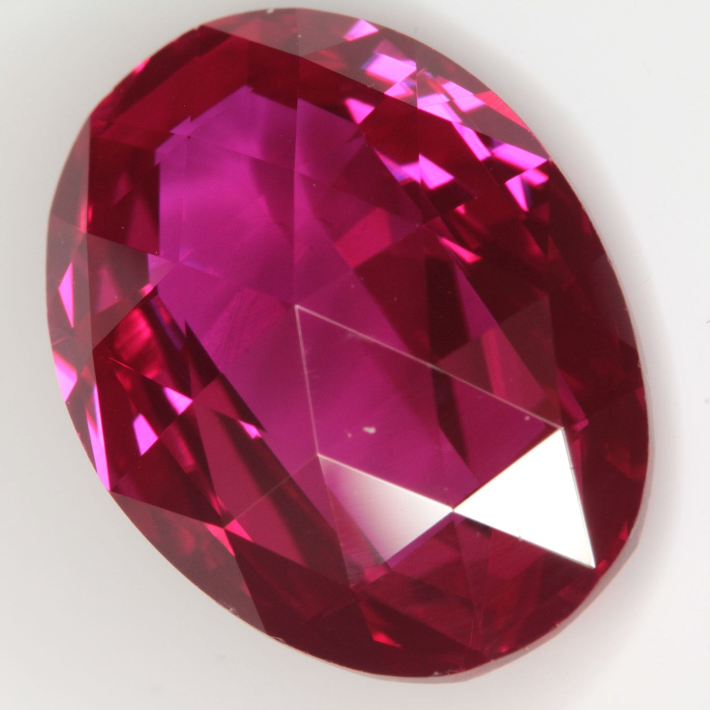 Faceted Flame Fusion Ruby Checkerboard Bent Oval Gemstone