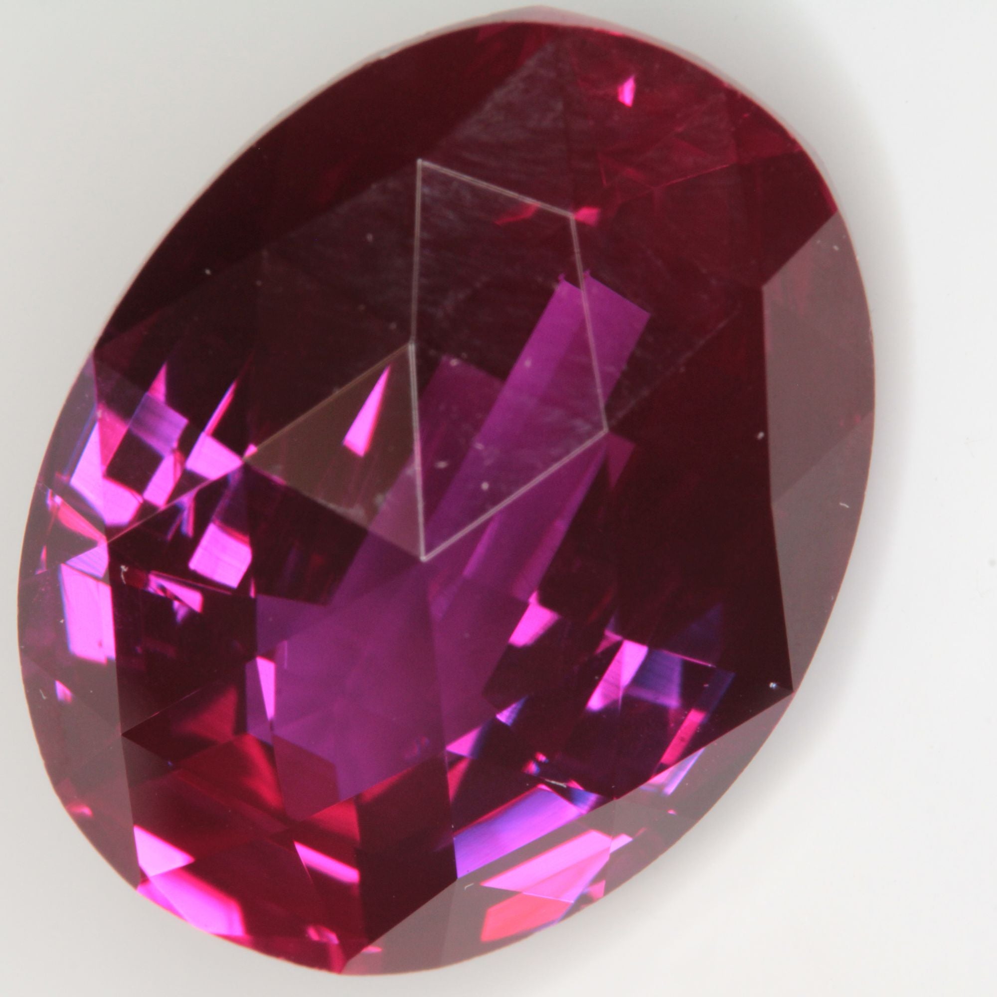 Faceted Flame Fusion Ruby Checkerboard Bent Oval Gemstone