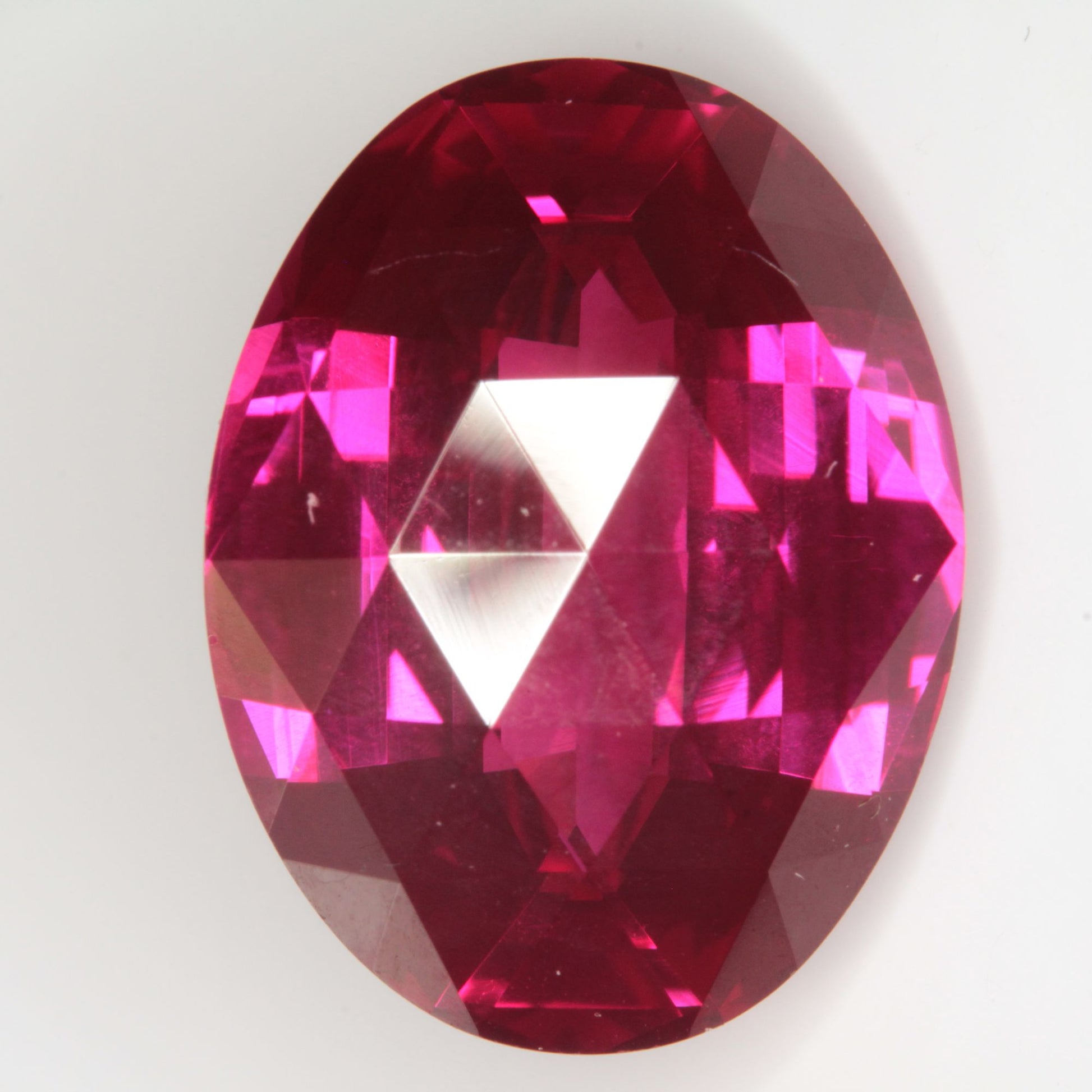Faceted Flame Fusion Ruby Checkerboard Bent Oval Gemstone