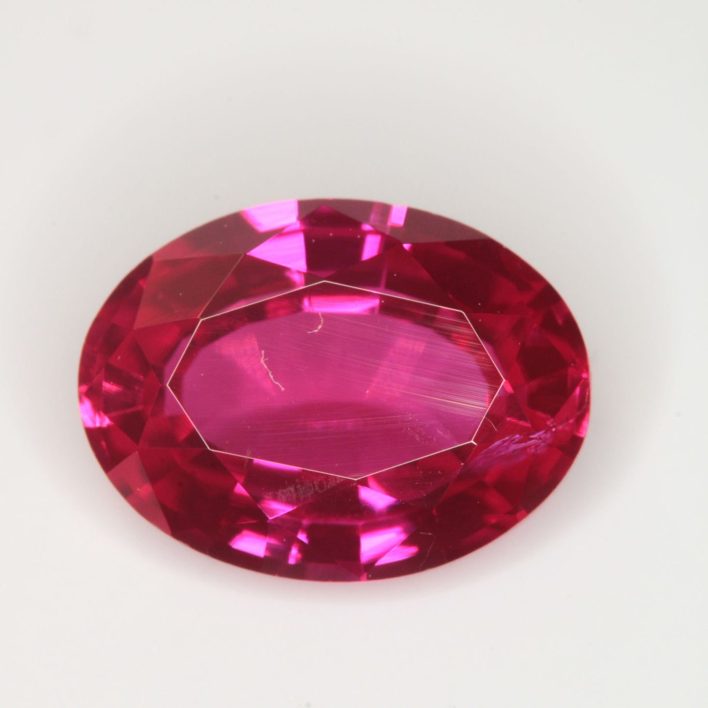 Faceted Flame Fusion Ruby Oval Gemstone