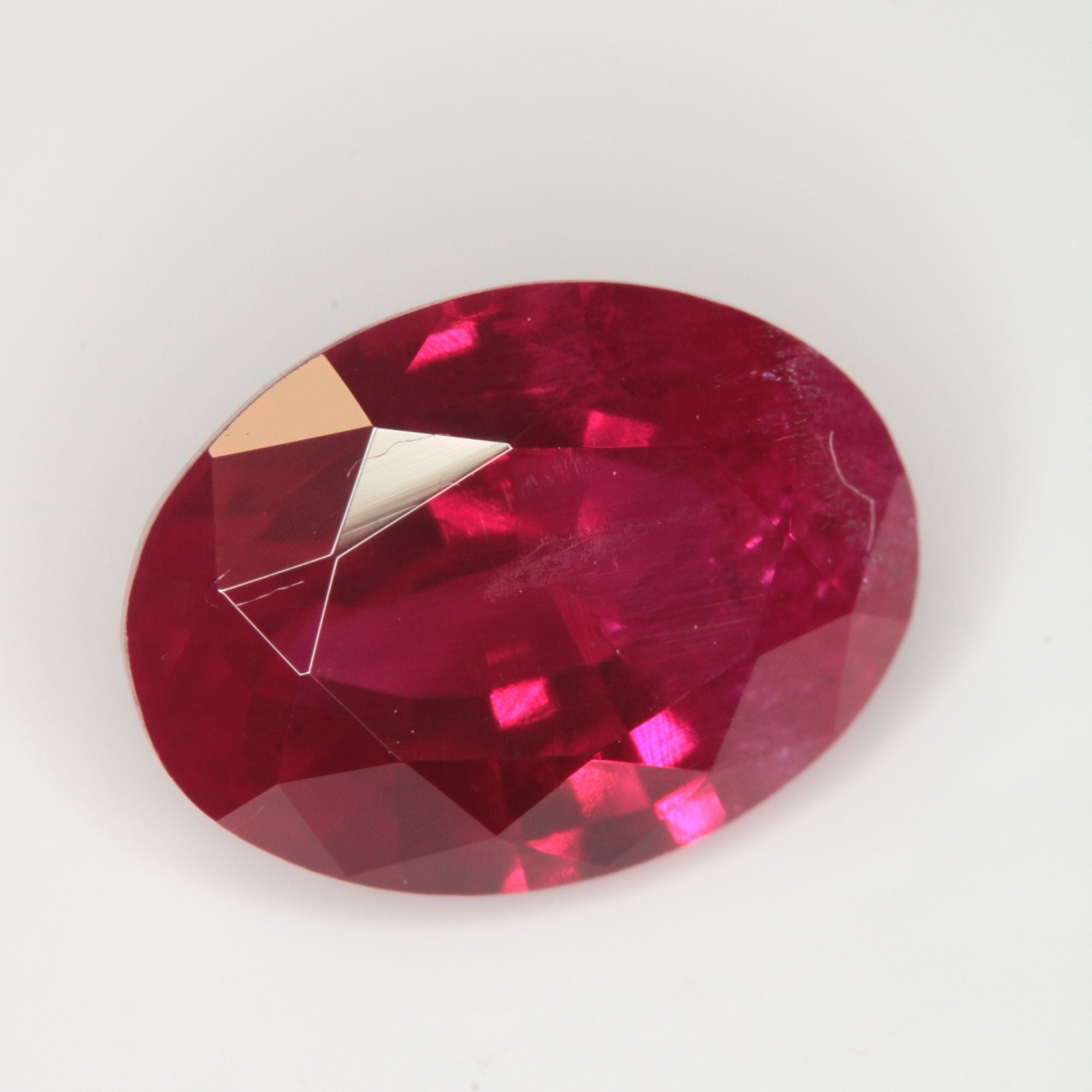 Faceted Flame Fusion Ruby Oval Gemstone