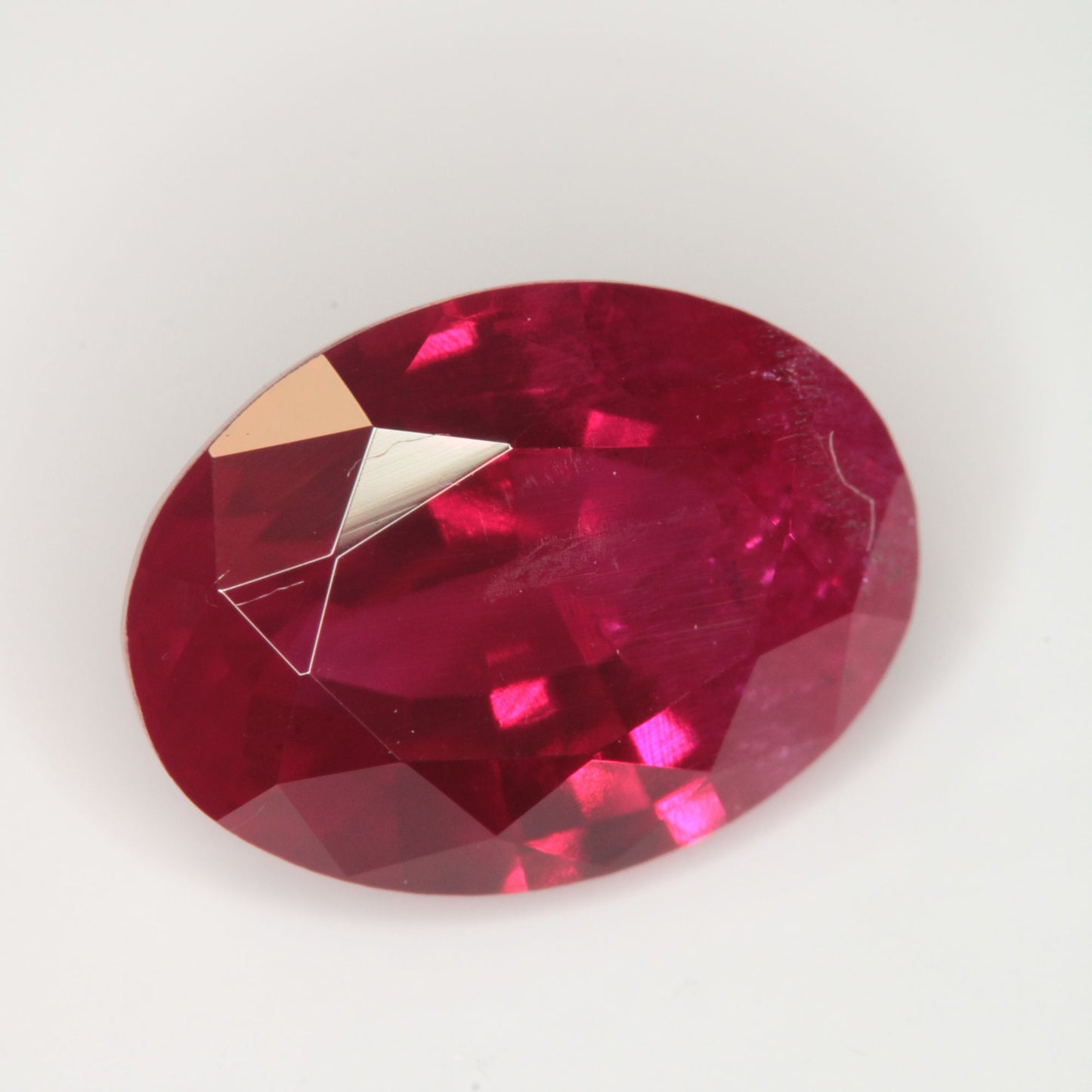 Faceted Flame Fusion Ruby Oval Gemstone