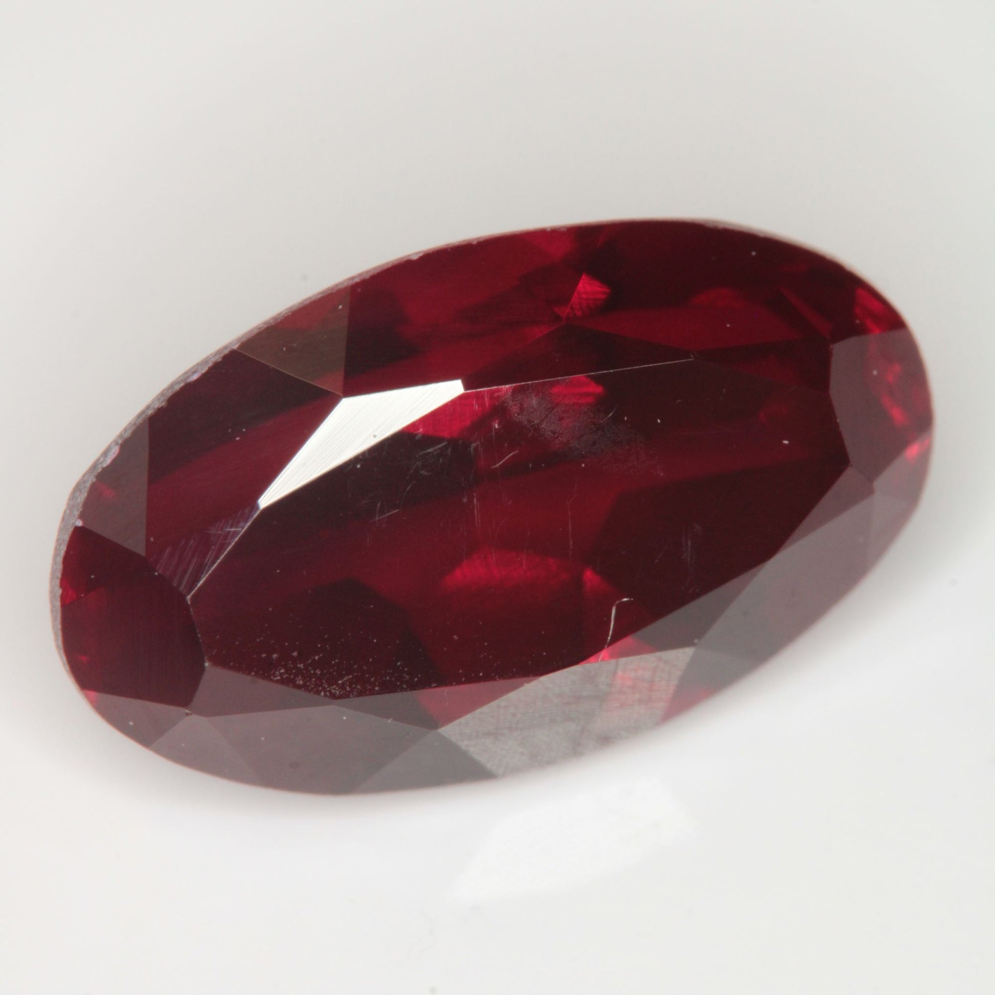 Faceted Flame Fusion Ruby Oval Gemstone