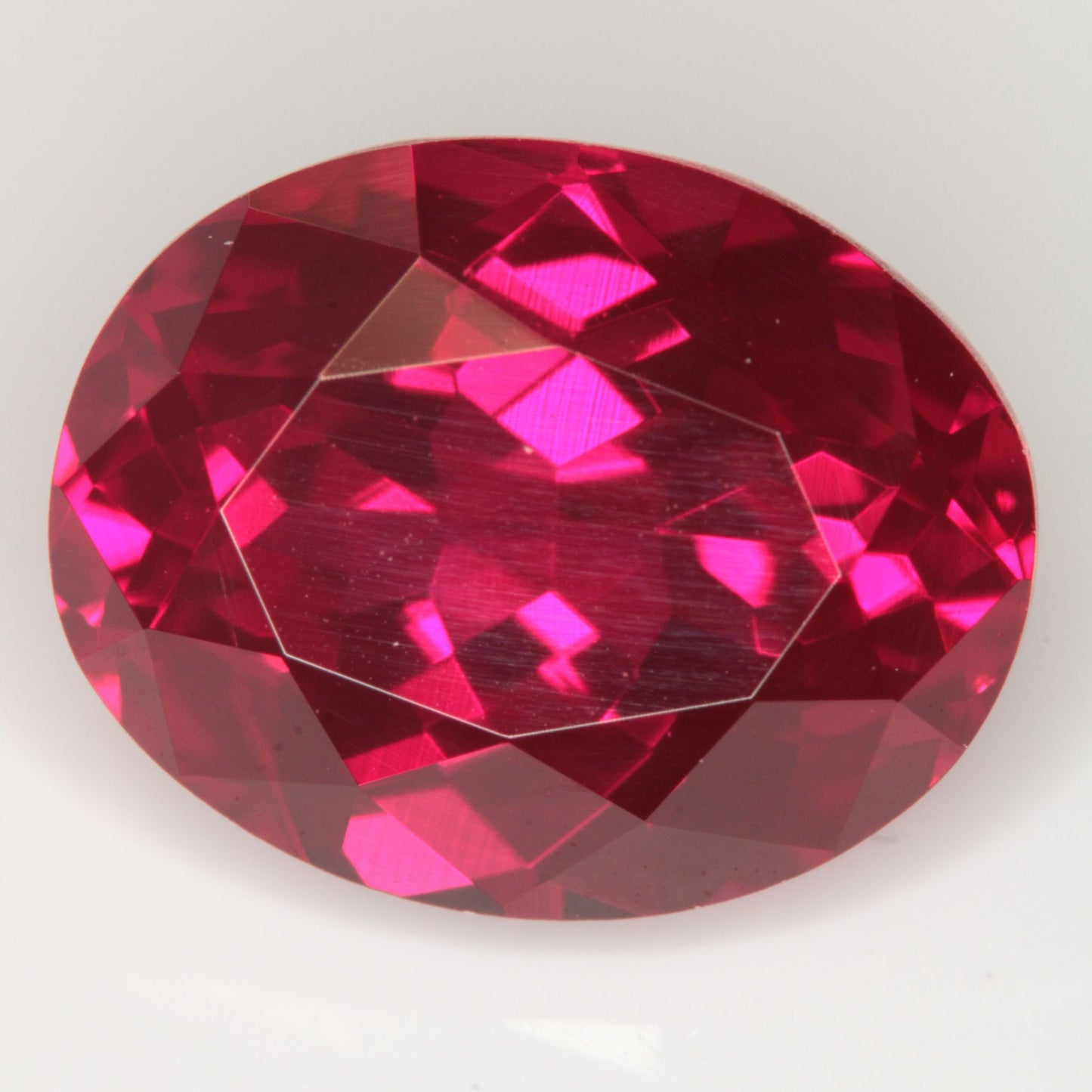 Faceted Flame Fusion Ruby Oval Gemstone