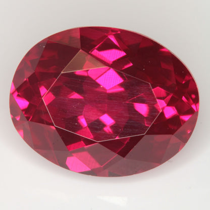 Faceted Flame Fusion Ruby Oval Gemstone