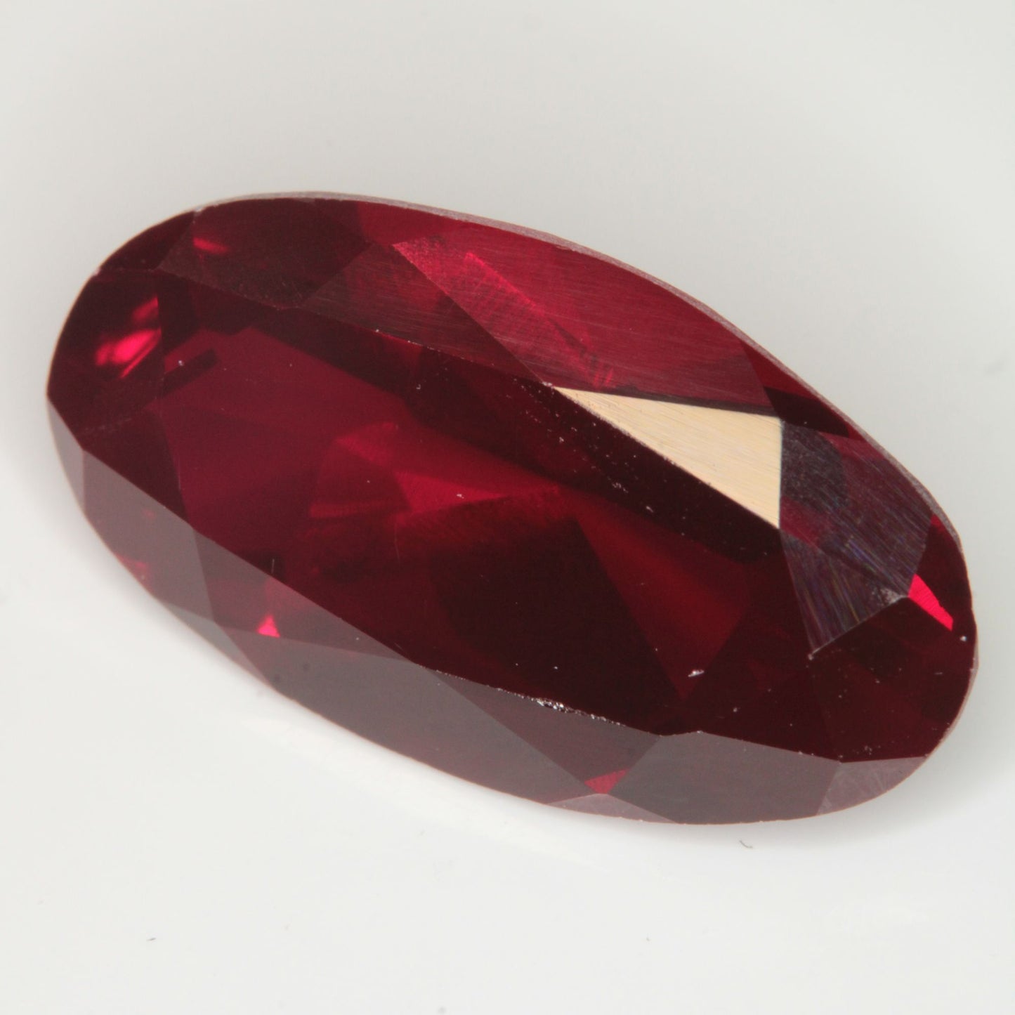 Faceted Flame Fusion Ruby Long Oval Gemstone