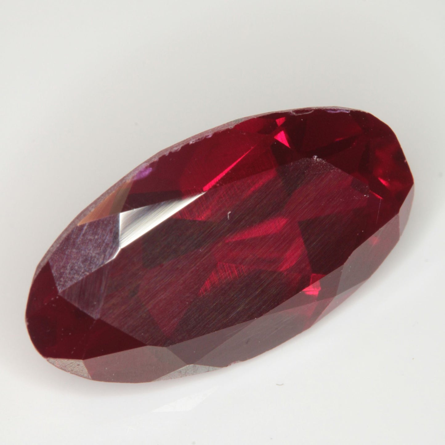 Faceted Flame Fusion Ruby Long Oval Gemstone