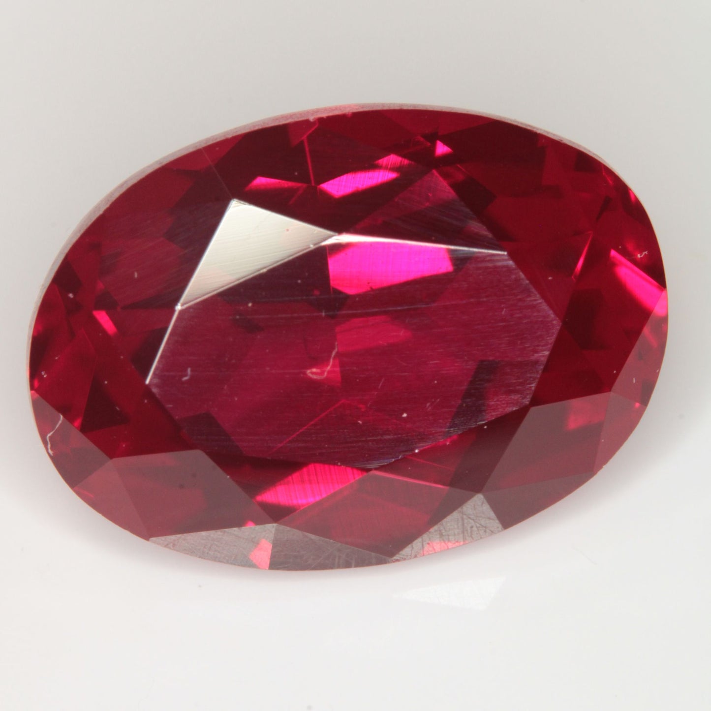Faceted Flame Fusion Ruby Oval Gemstone