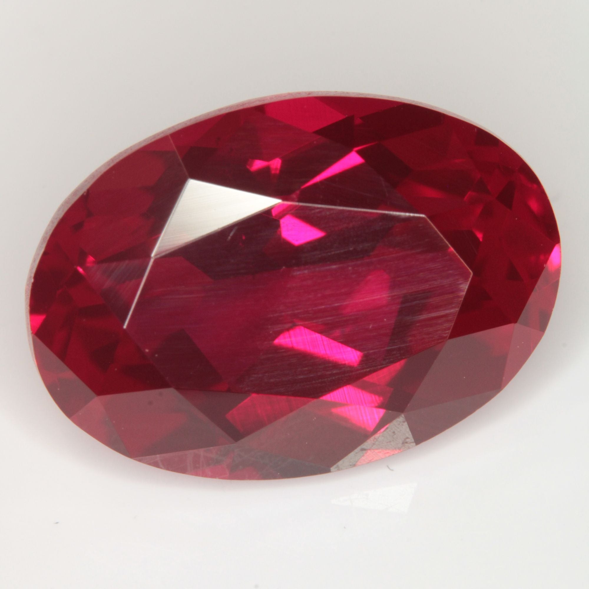 Faceted Flame Fusion Ruby Oval Gemstone
