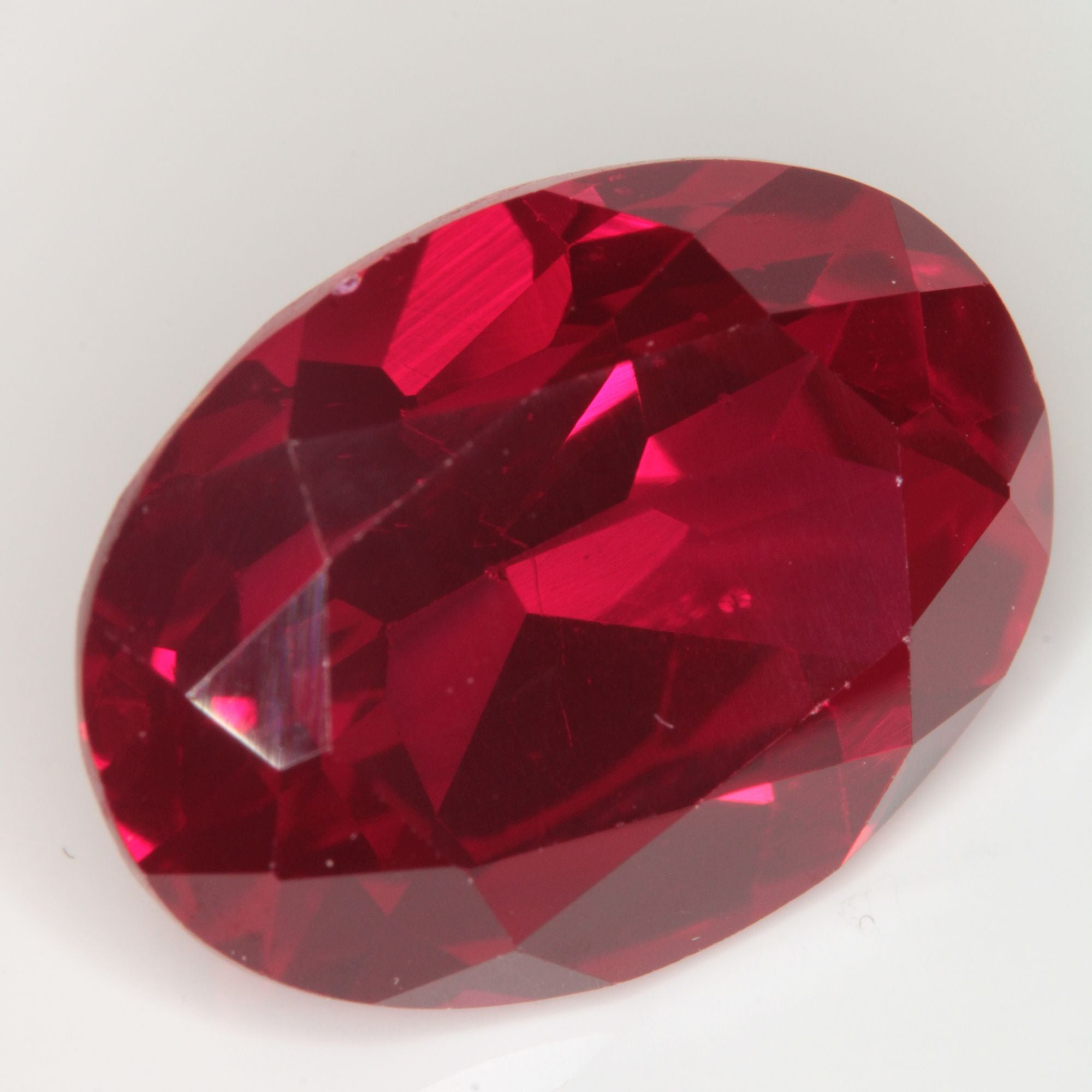 Faceted Flame Fusion Ruby Oval Gemstone