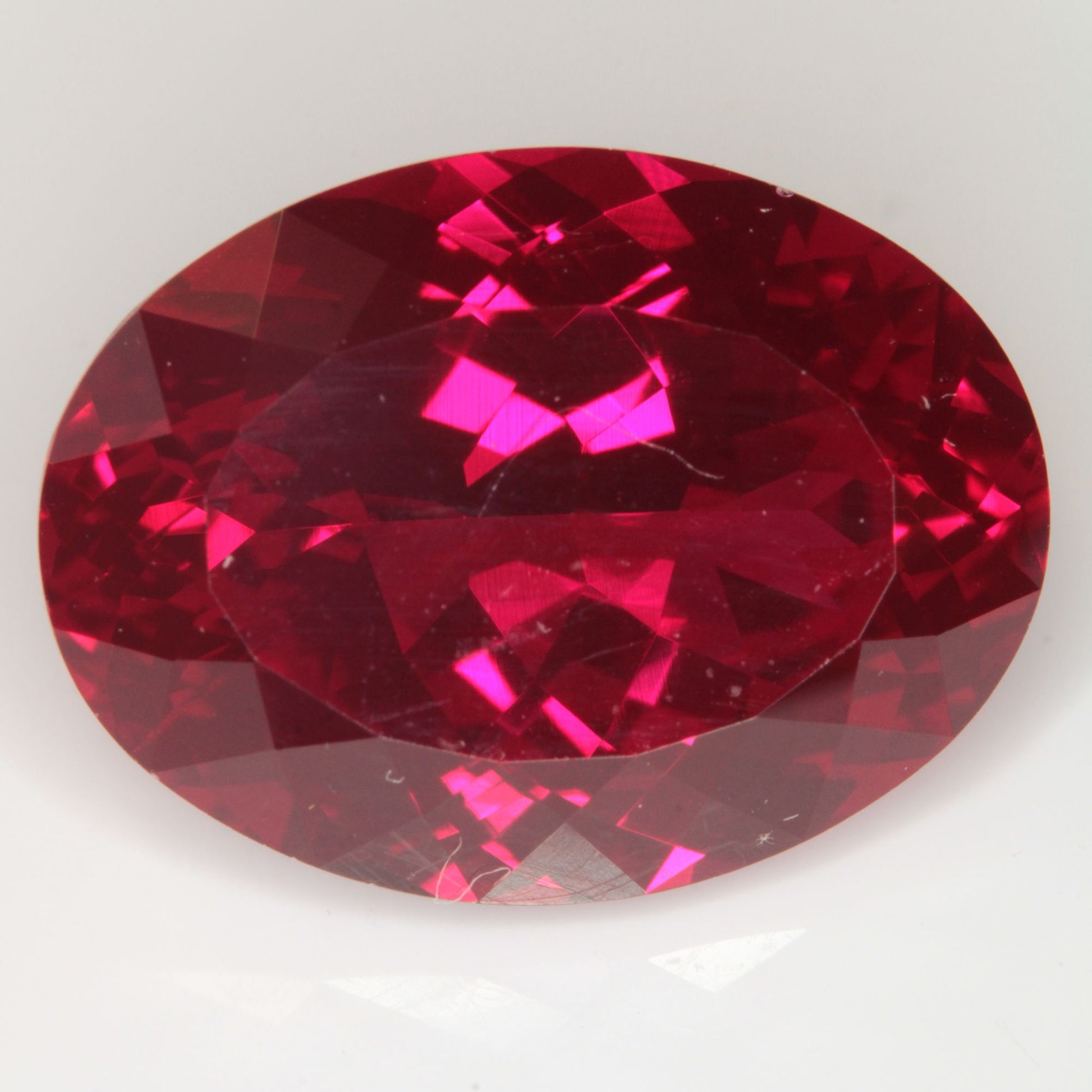 Faceted Flame Fusion Ruby Oval Gemstone