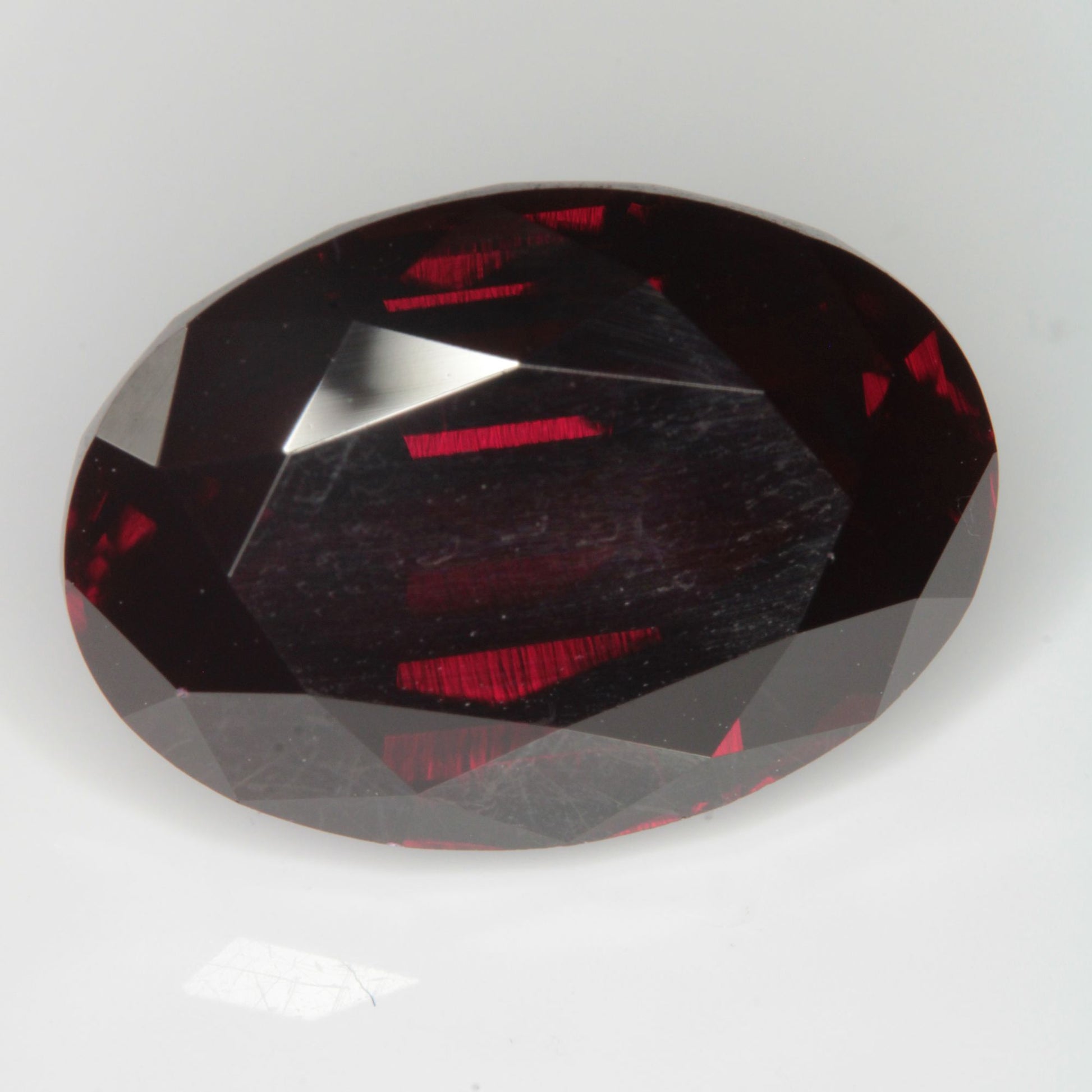 Faceted Flame Fusion Ruby Oval Gemstone