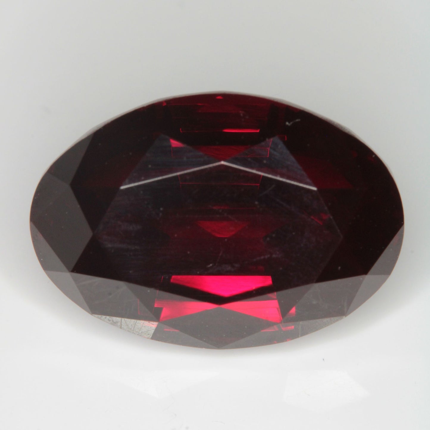 Faceted Flame Fusion Ruby Oval Gemstone