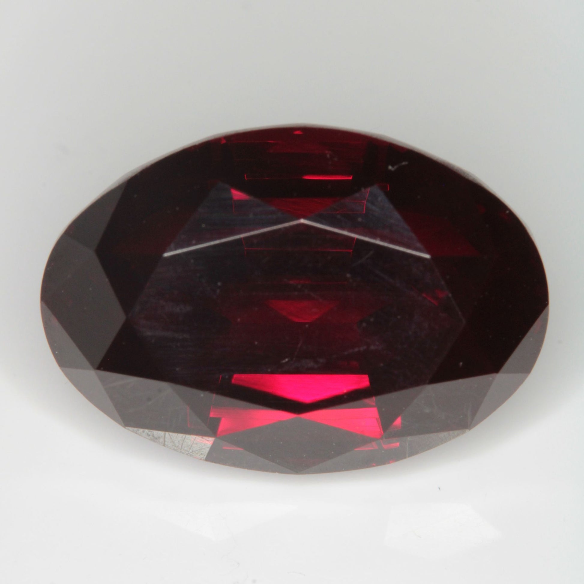 Faceted Flame Fusion Ruby Oval Gemstone