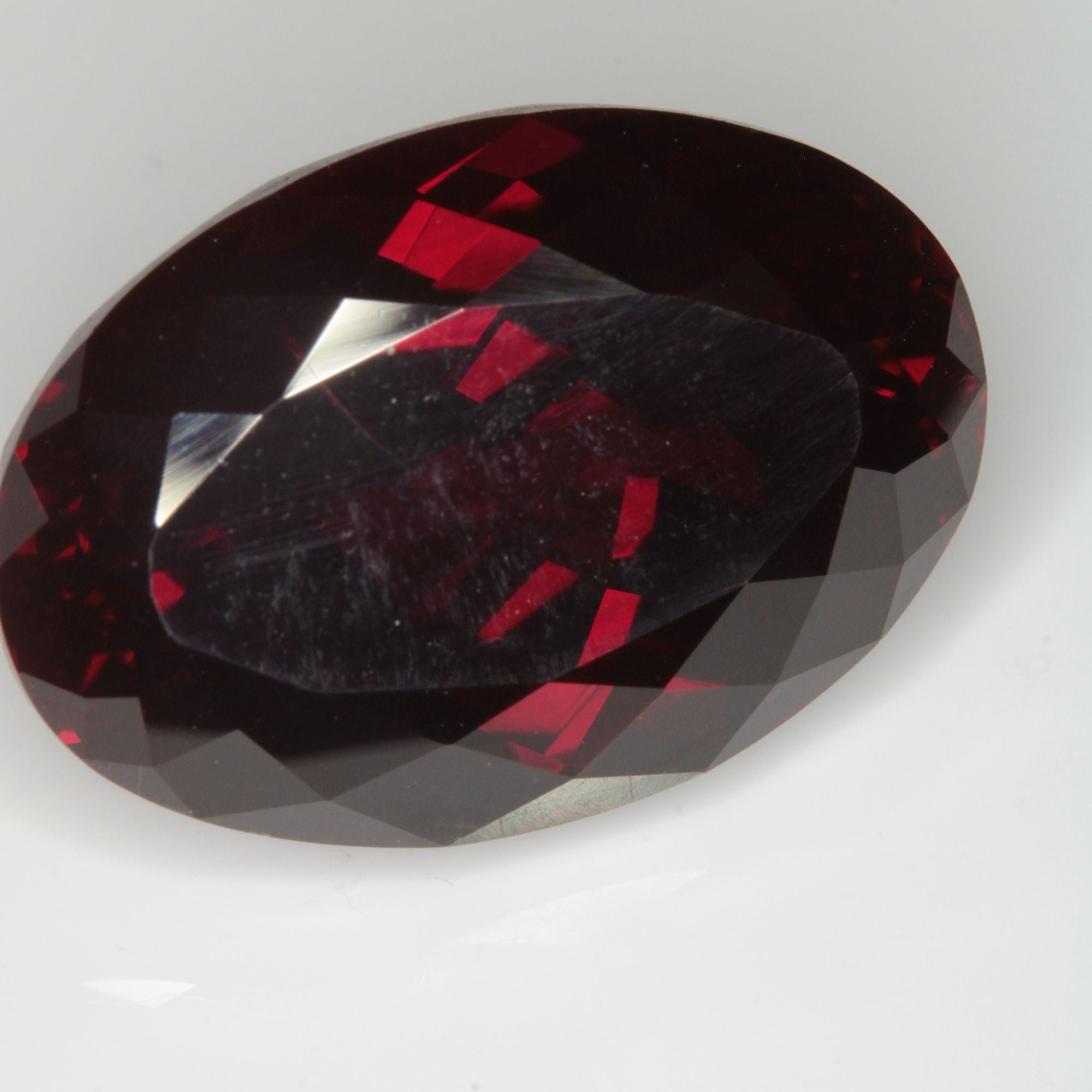 Faceted Flame Fusion Ruby Oval Gemstone