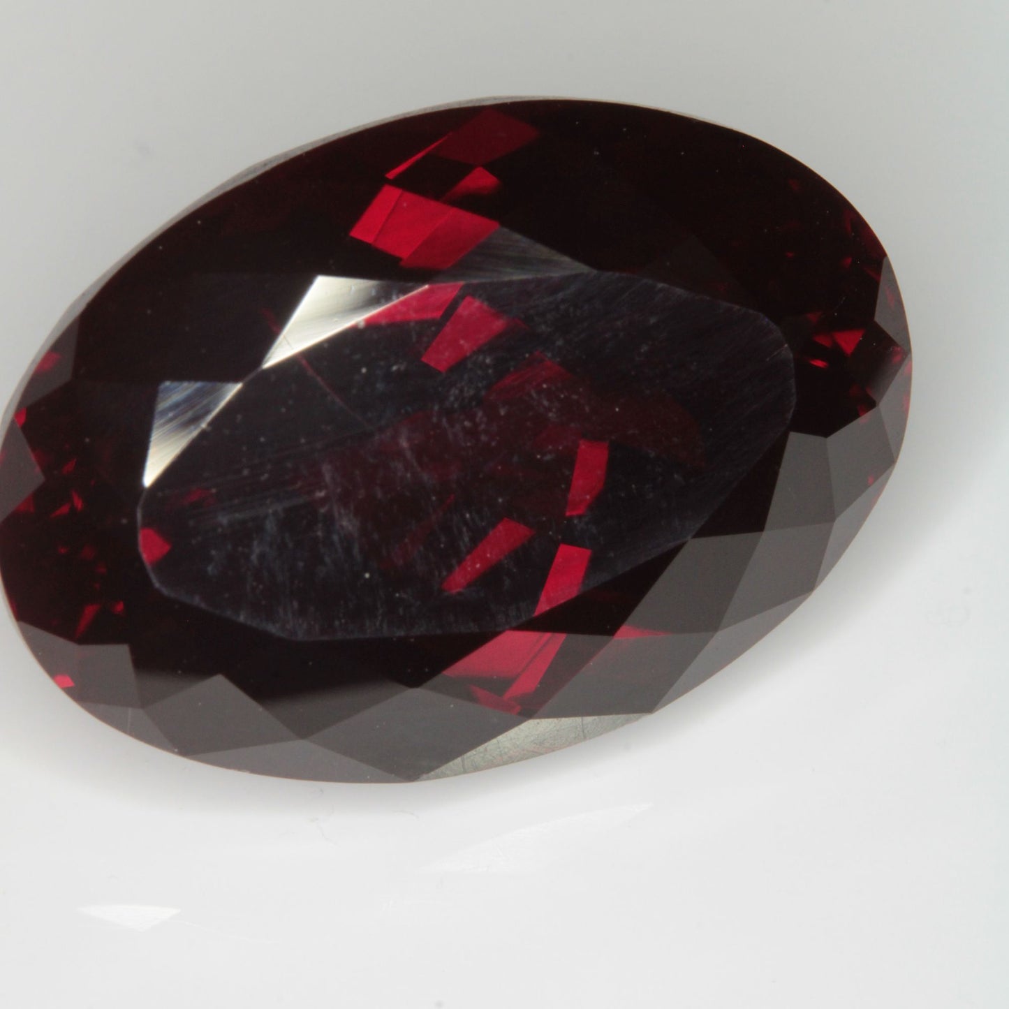 Faceted Flame Fusion Ruby Oval Gemstone