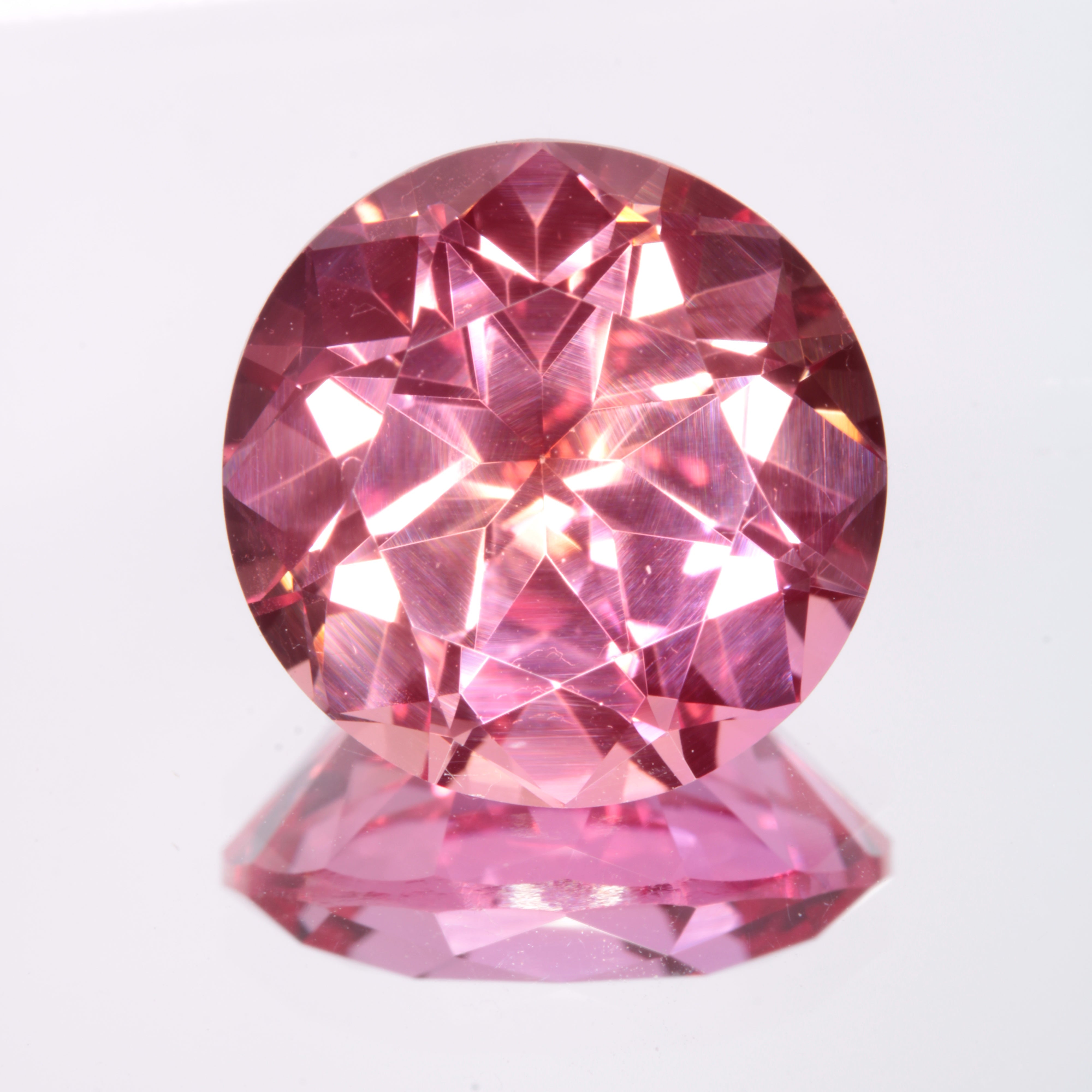 Faceted Orange-Pink Round Fancy Sapphire Gem