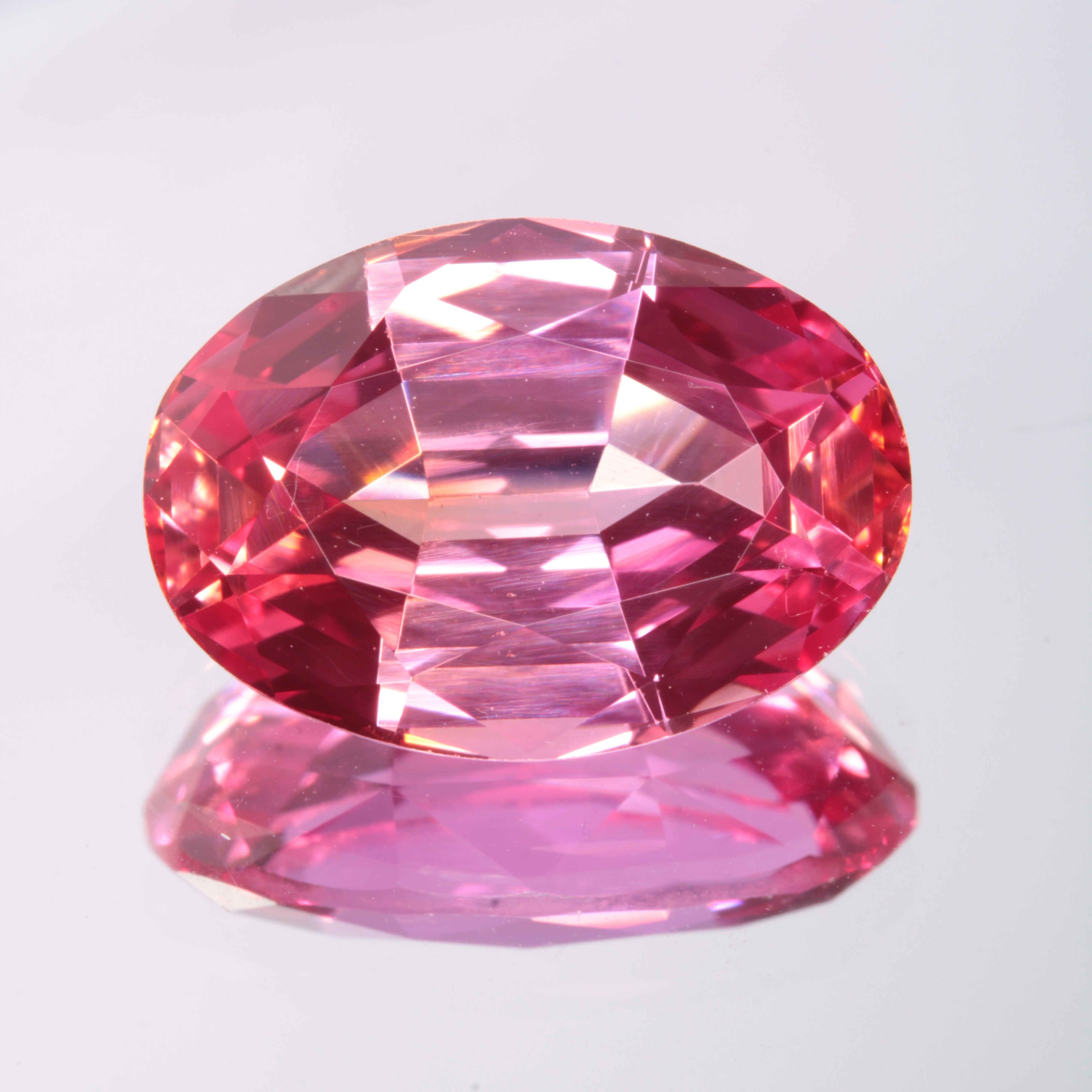 Faceted Orange-Pink Oval Fancy Sapphire Gem