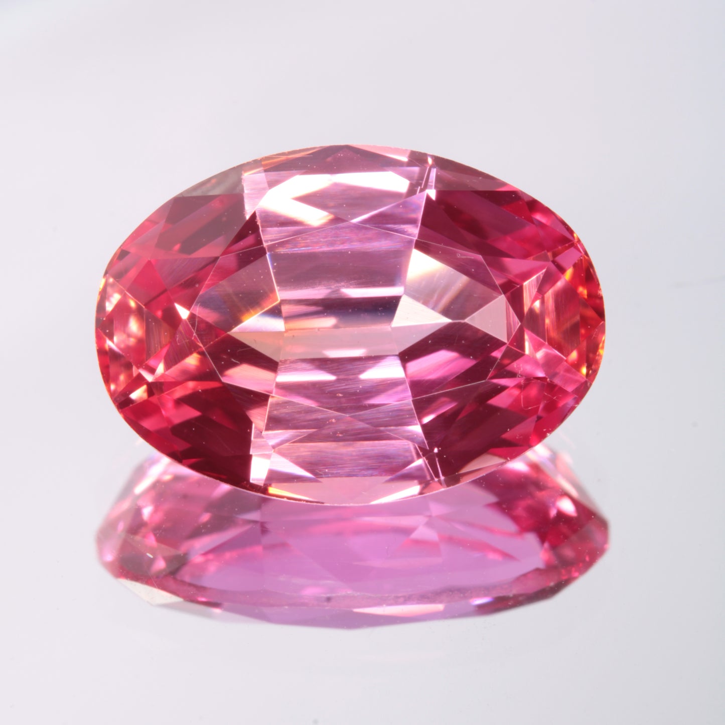 Faceted Orange-Pink Oval Fancy Sapphire Gem