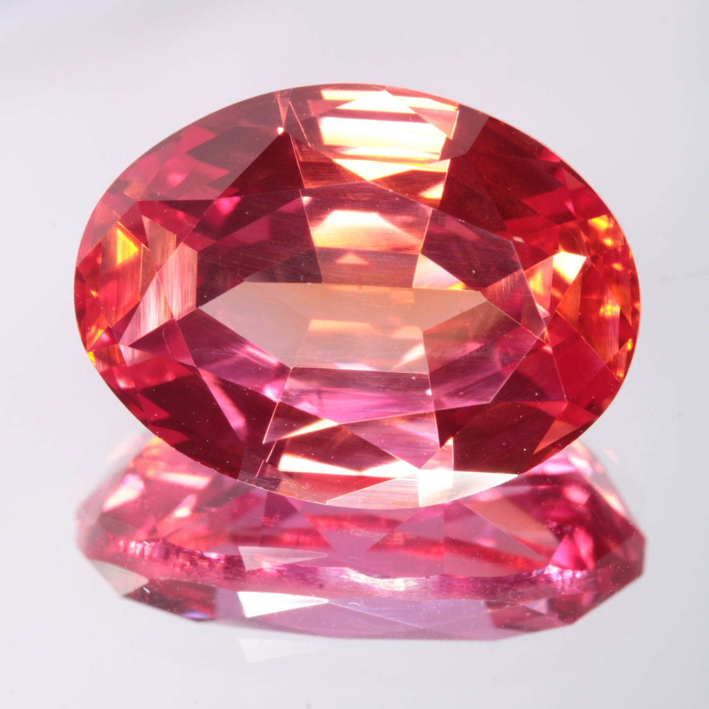 Faceted Orange-Red Oval Fancy Sapphire Gem