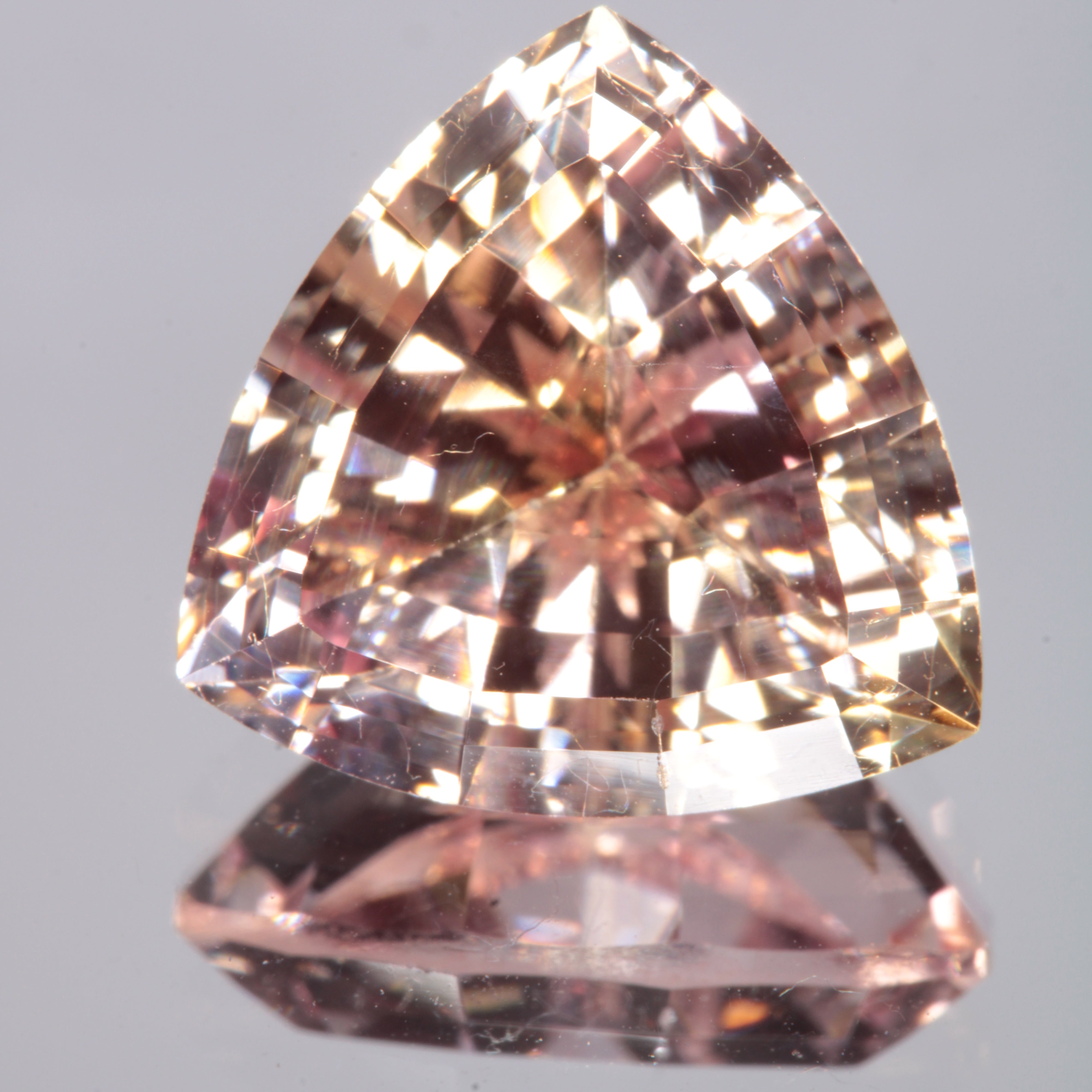 Faceted Light Orange Trillion Fancy Sapphire Gem