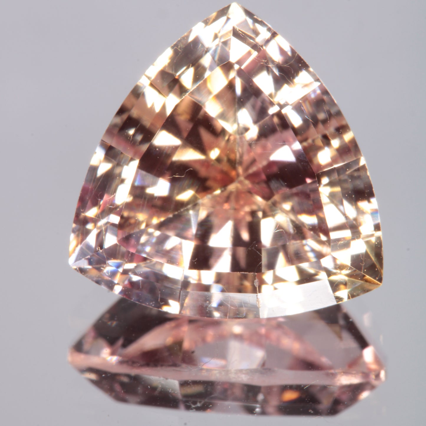 Faceted Light Orange Trillion Fancy Sapphire Gem