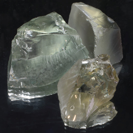 Several pieces of weird Yb:YAG rough of various colors, yttrium aluminum garnet with ytterbium