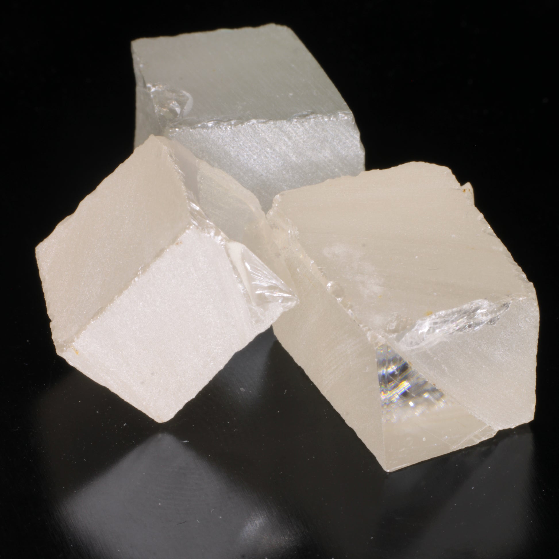 Three pieces of white moissanite gemstone facet rough.