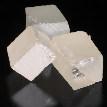 Three pieces of white moissanite gemstone facet rough.