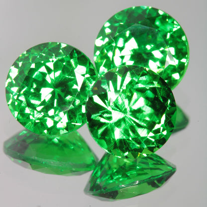 Green CTH:YAG 6mm Round faceted lab gemstone