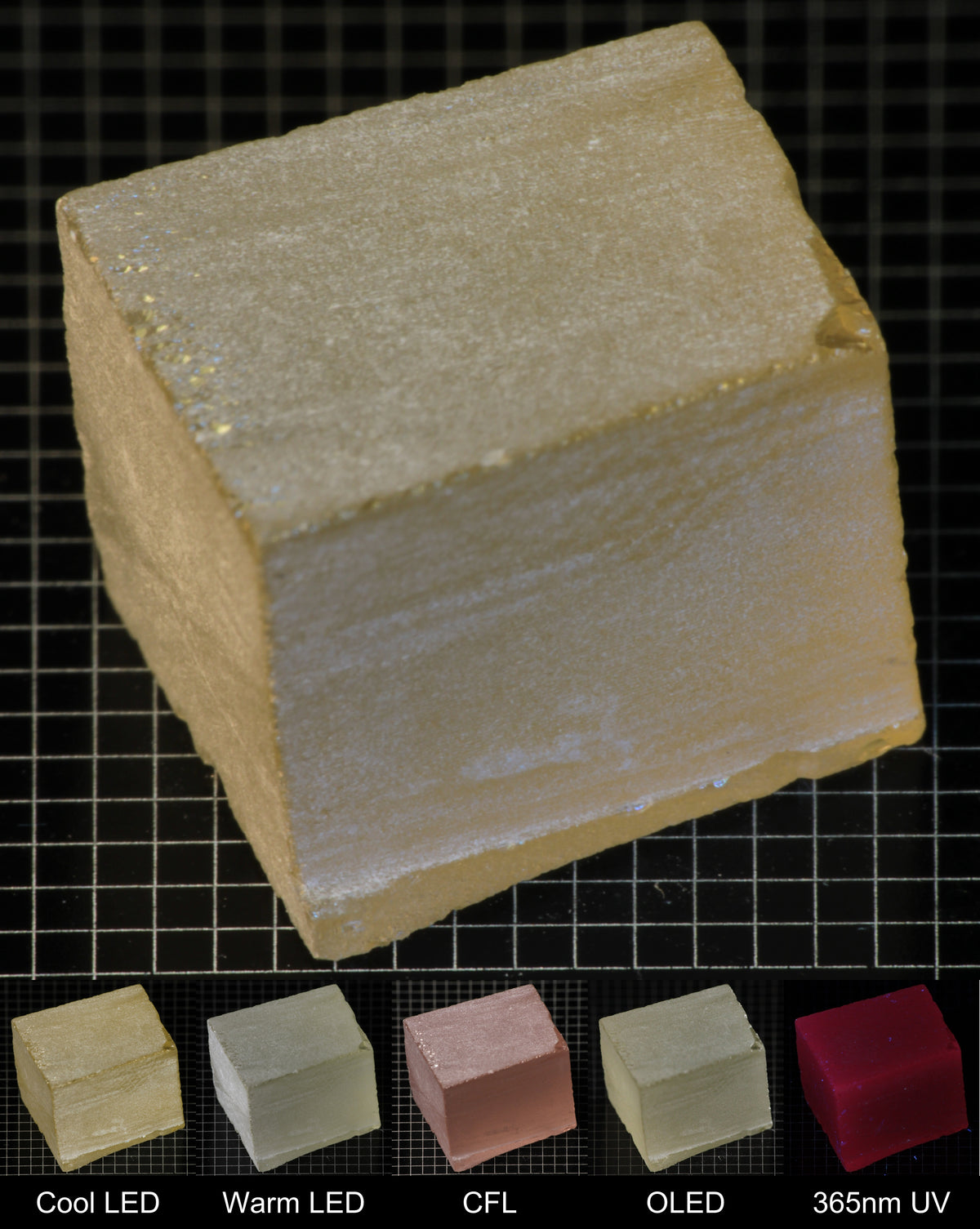 Darker Block of Ho:YAG Gem Rough, showing color changes from yellow to pink under different lighting conditions.