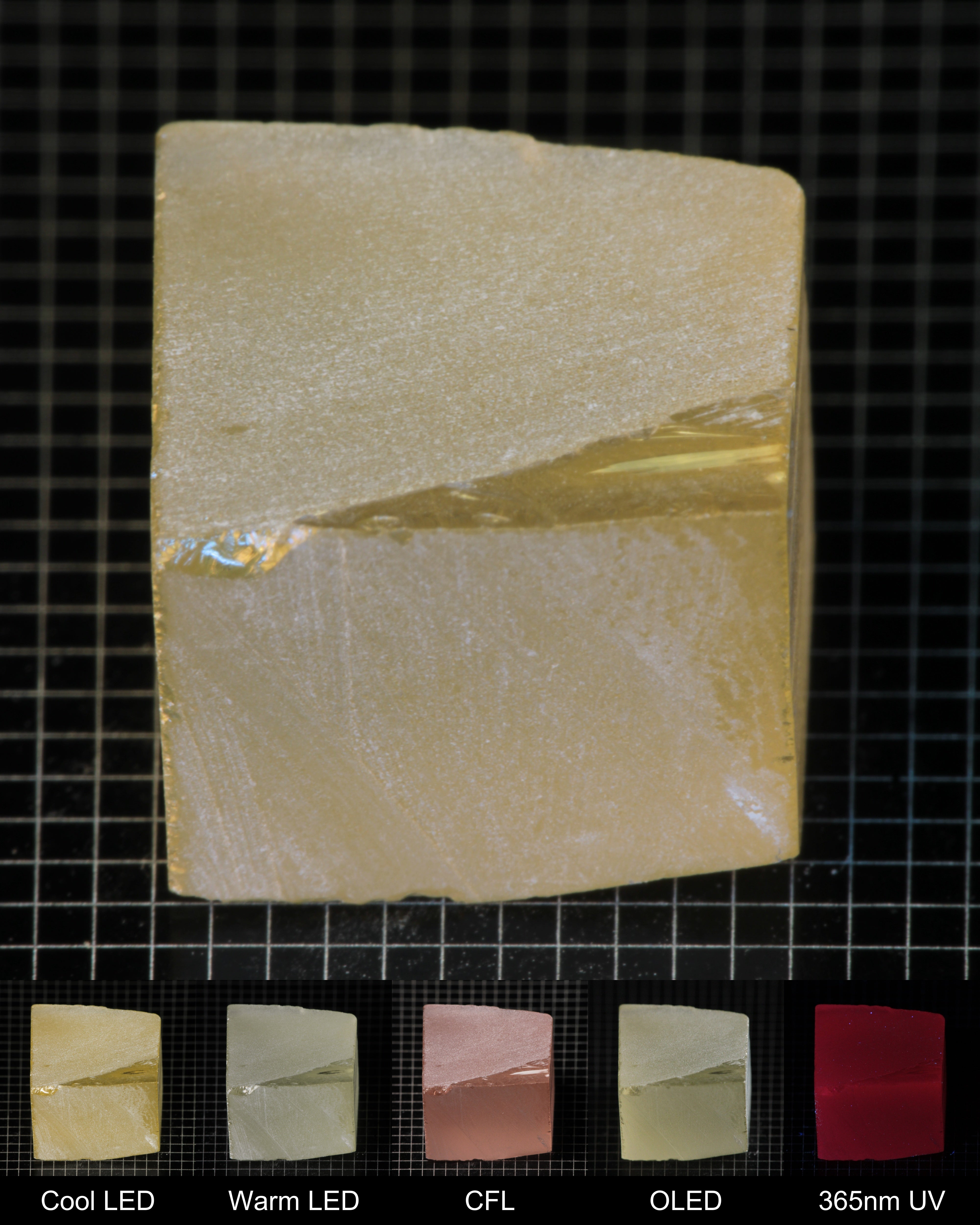 Darker Block of Ho:YAG Gem Rough, showing color changes from yellow to pink under different lighting conditions.