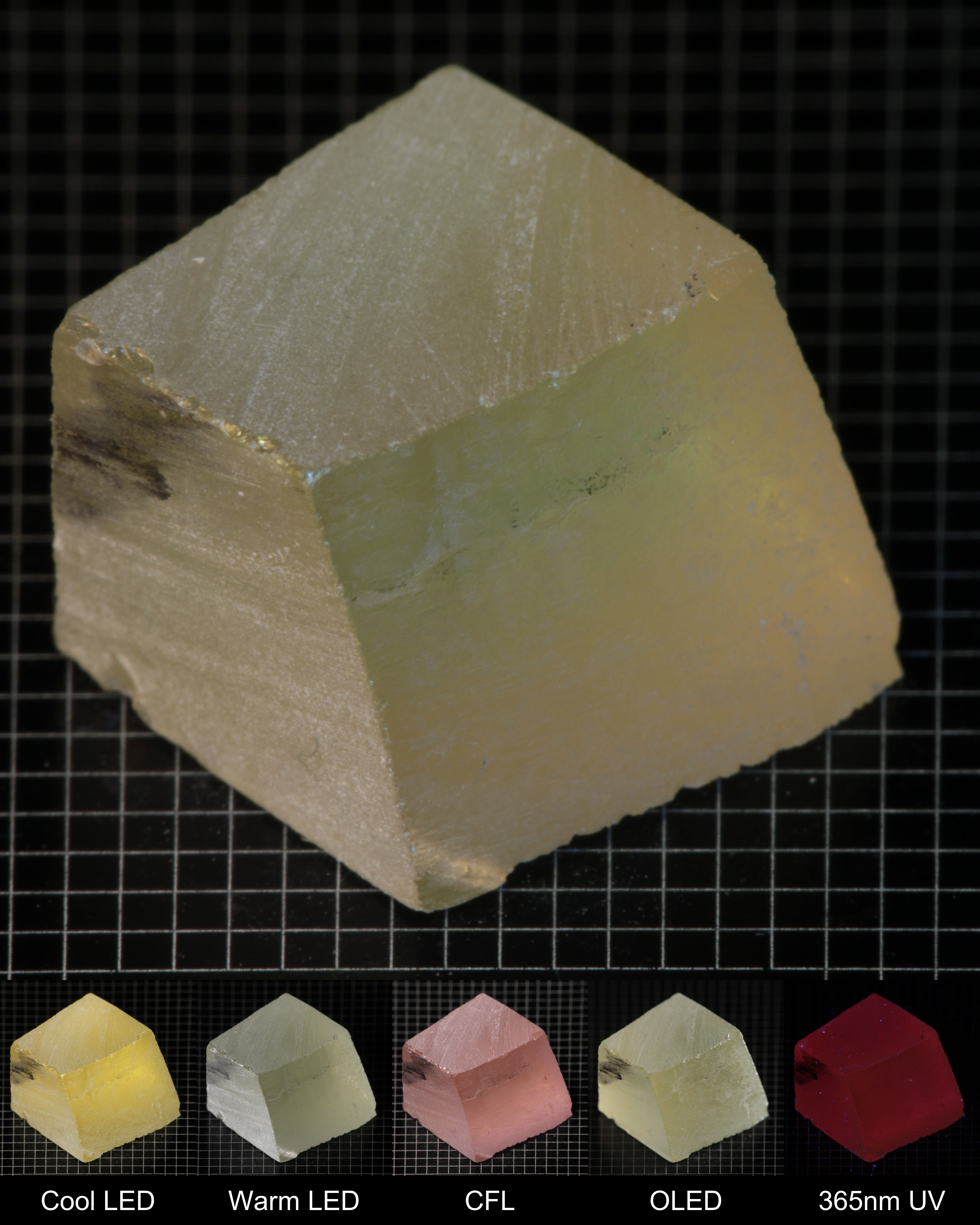 Darker Block of Ho:YAG Gem Rough, showing color changes from yellow to pink under different lighting conditions.