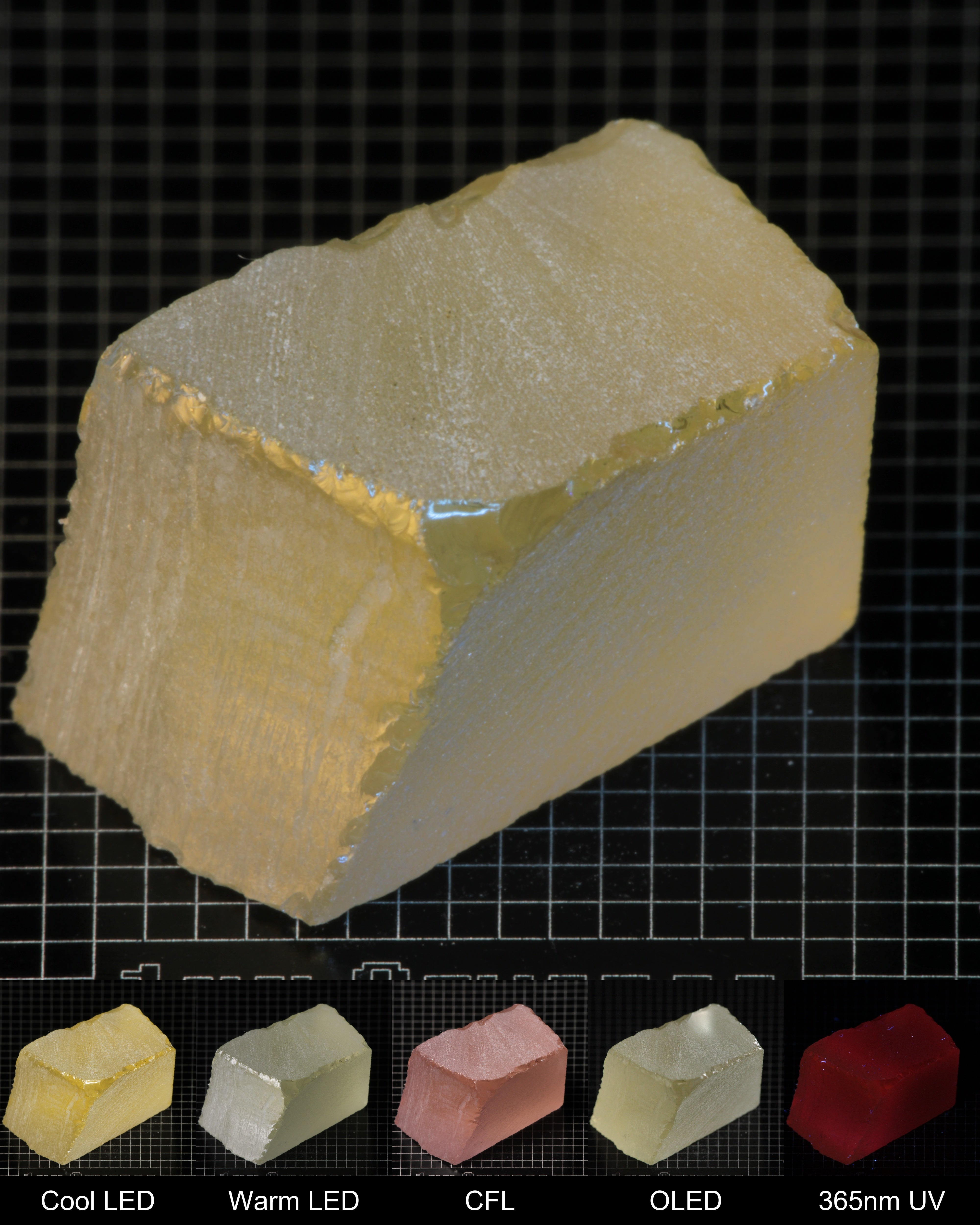 Darker Block of Ho:YAG Gem Rough, showing color changes from yellow to pink under different lighting conditions.