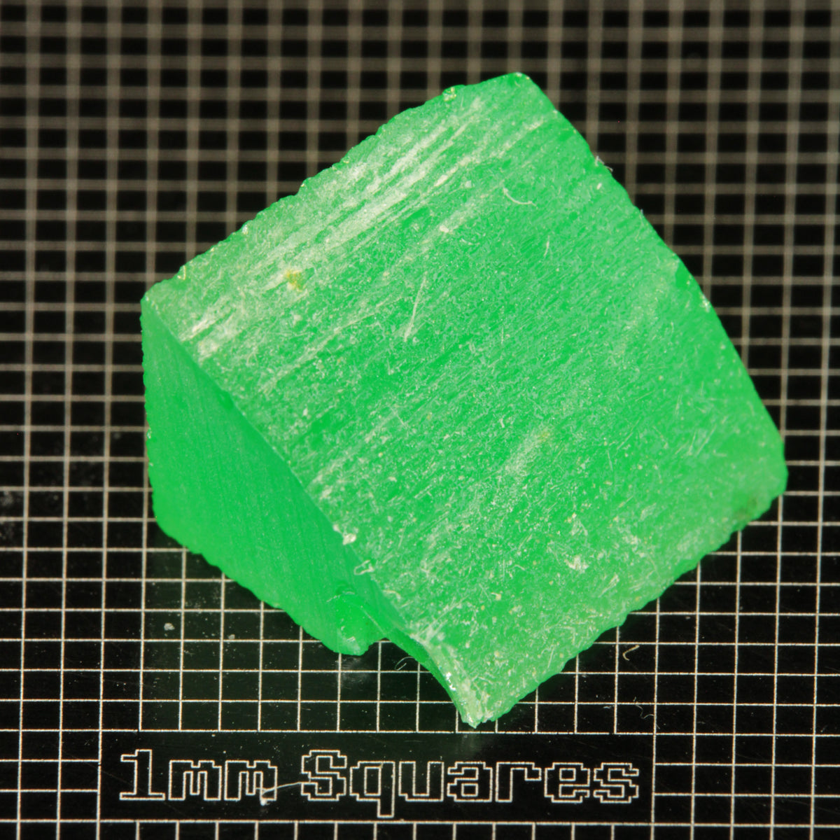 Rough Edge of bright green Vanadium YAG crystal