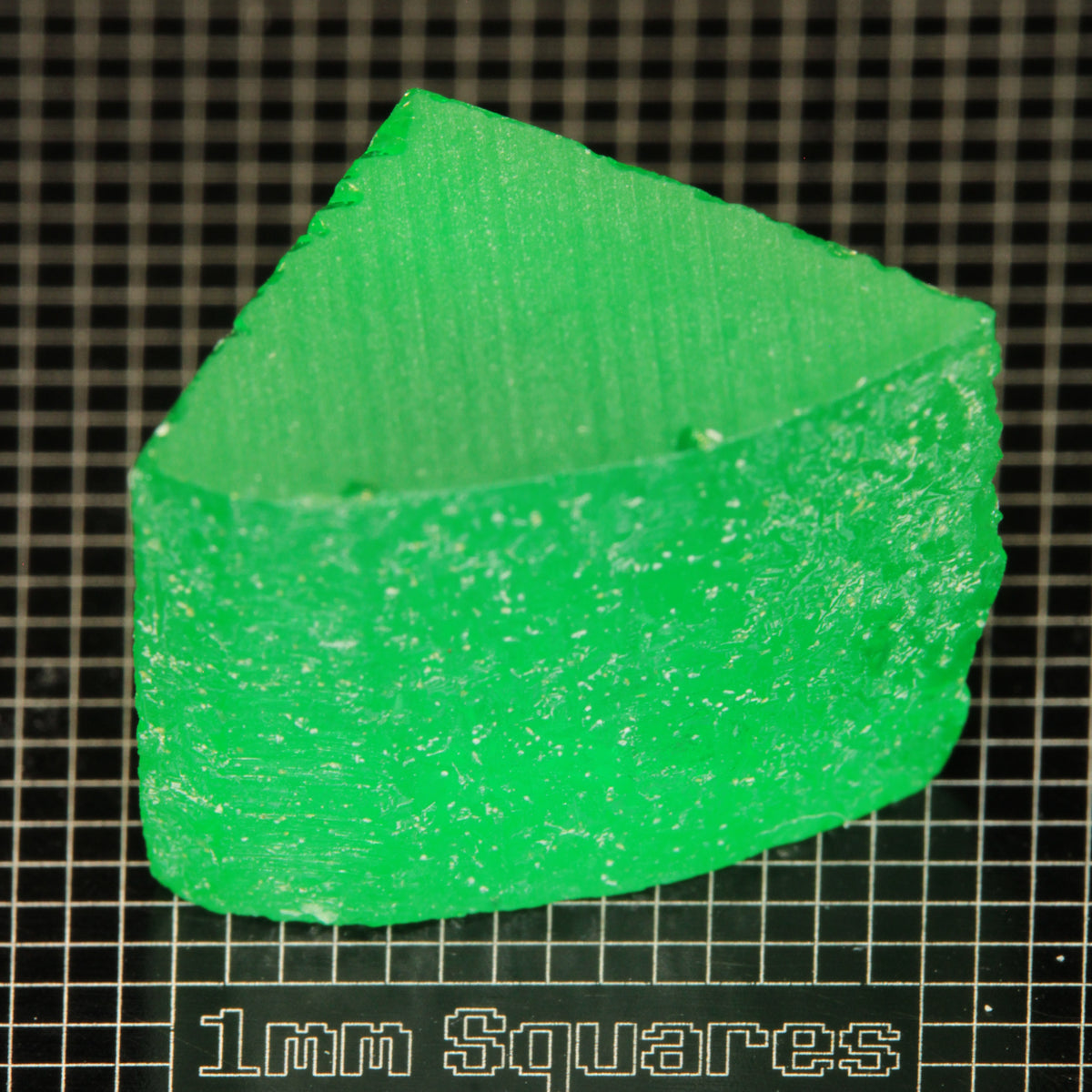 Rough Edge of bright green Vanadium YAG crystal