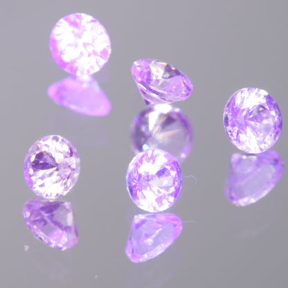 Faceted 2mm Round (Pink Glow) YAG:Nd:Ce Gemstone