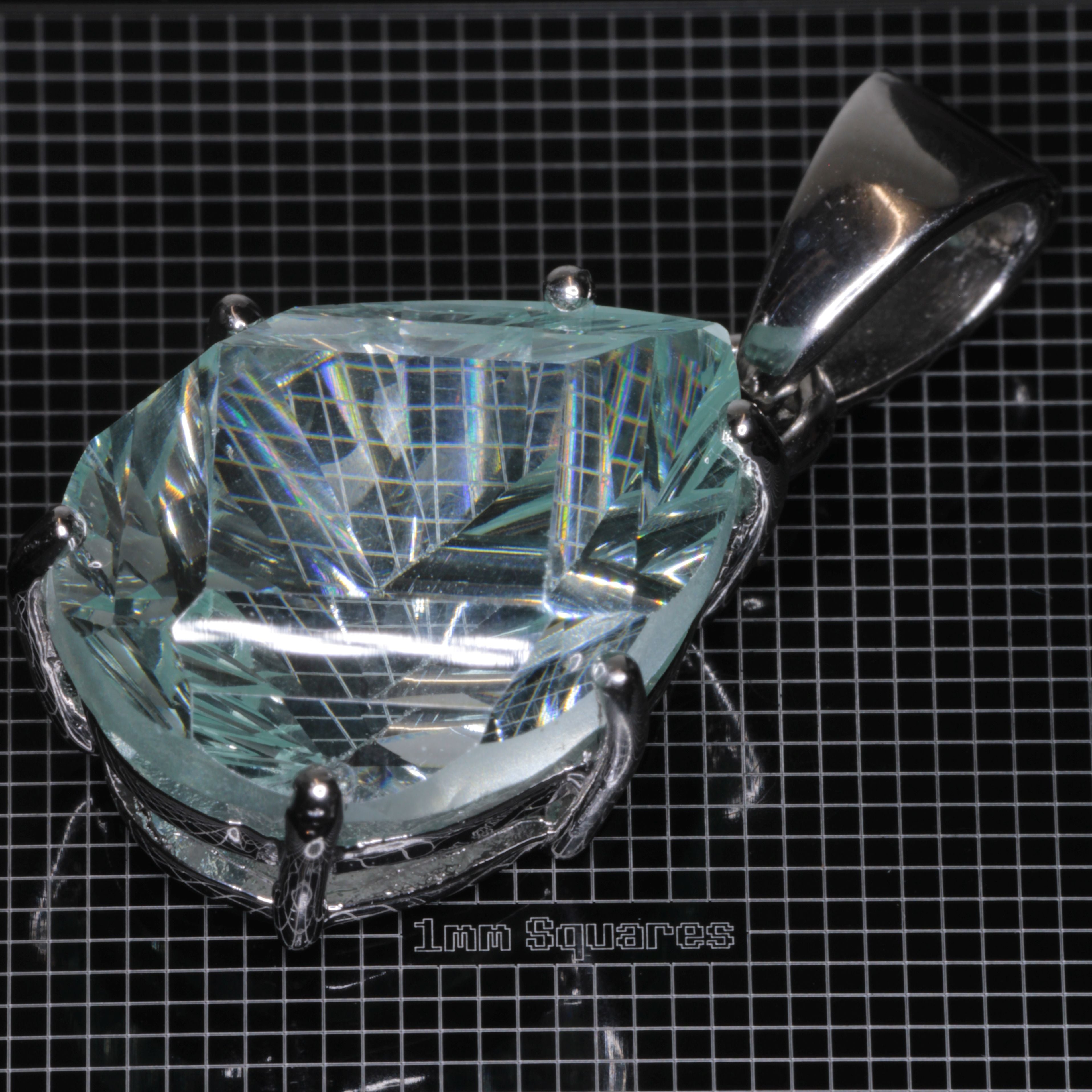 Fantasy Cut Pear-cut Light Blue Yb:YAG Gemstone in sterling silver pendants